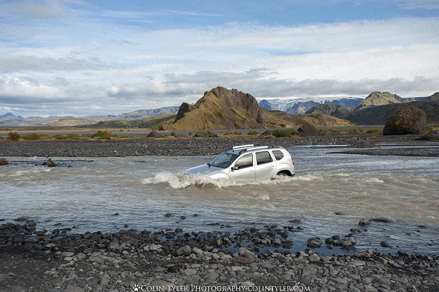 Driving through one of many rivers in Pórsmörk Valley