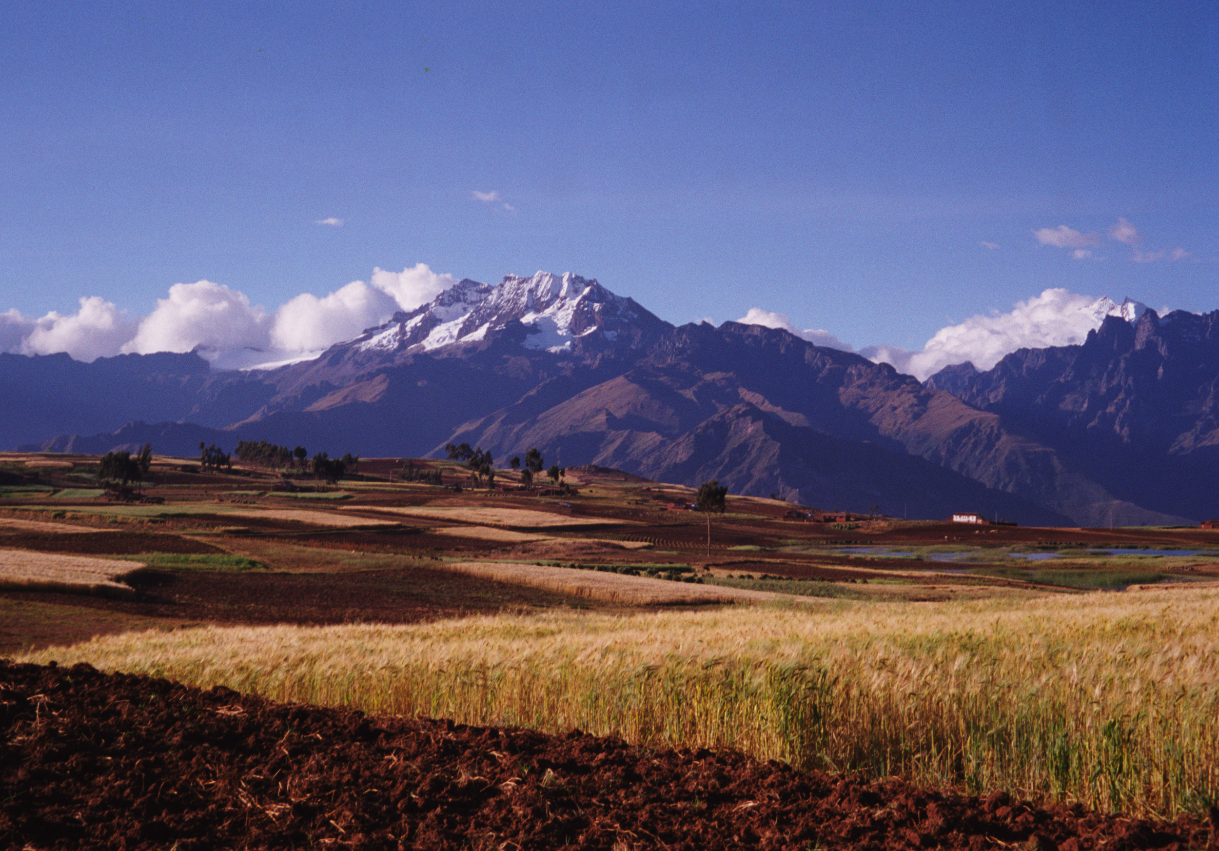 Farmland and The Andes Mountains outside Cusco, Peru