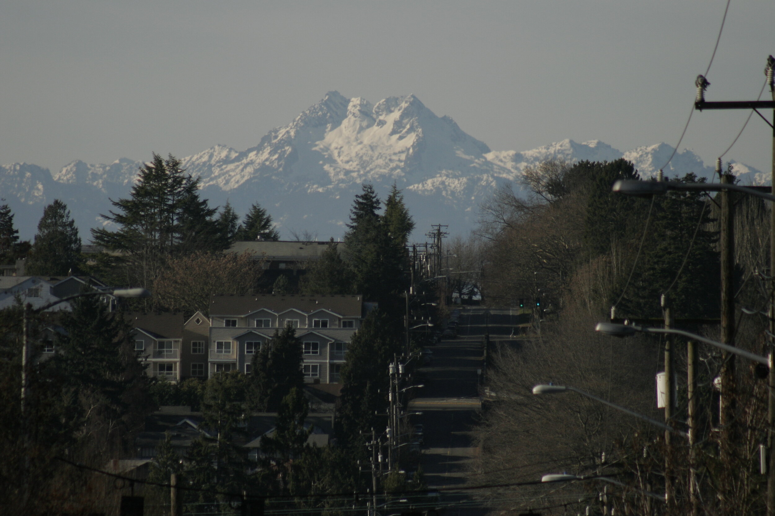 Olympic Mountains over Wallingford neighborhood from 50th Street - Seattle
