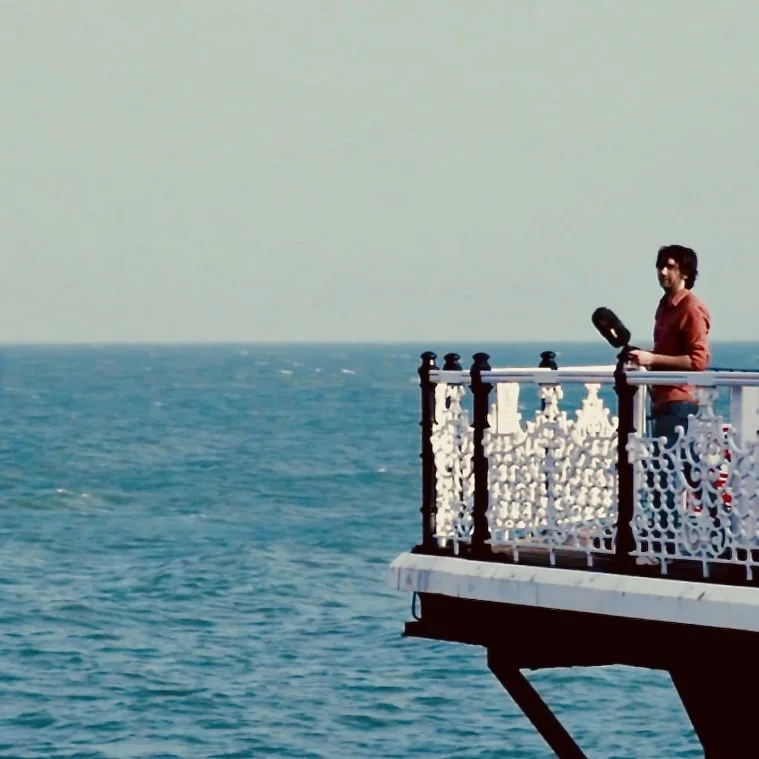 me on pier with mic.jpeg