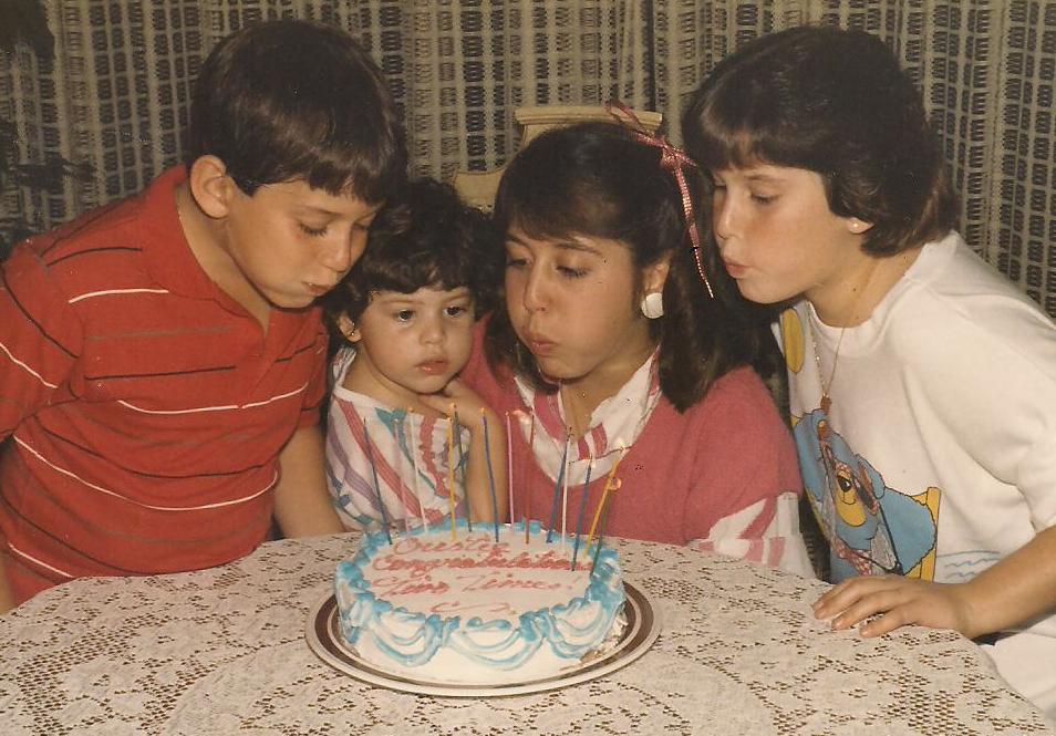  Blowing out the candles was a family affair. 