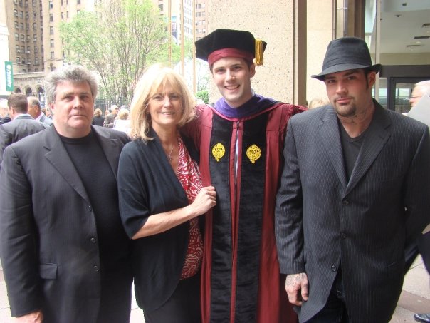  Matt, his parents and brother at law school graduation. 