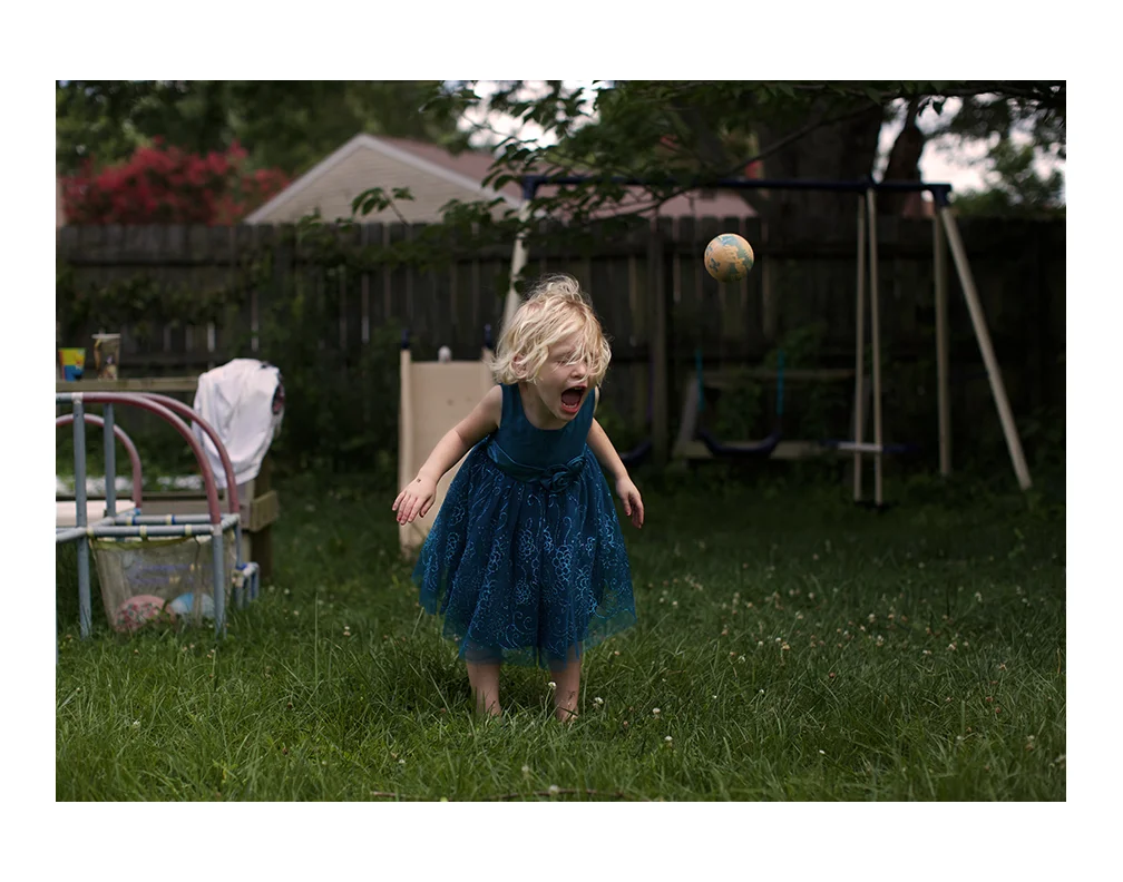 Elena playing in her backyard. 