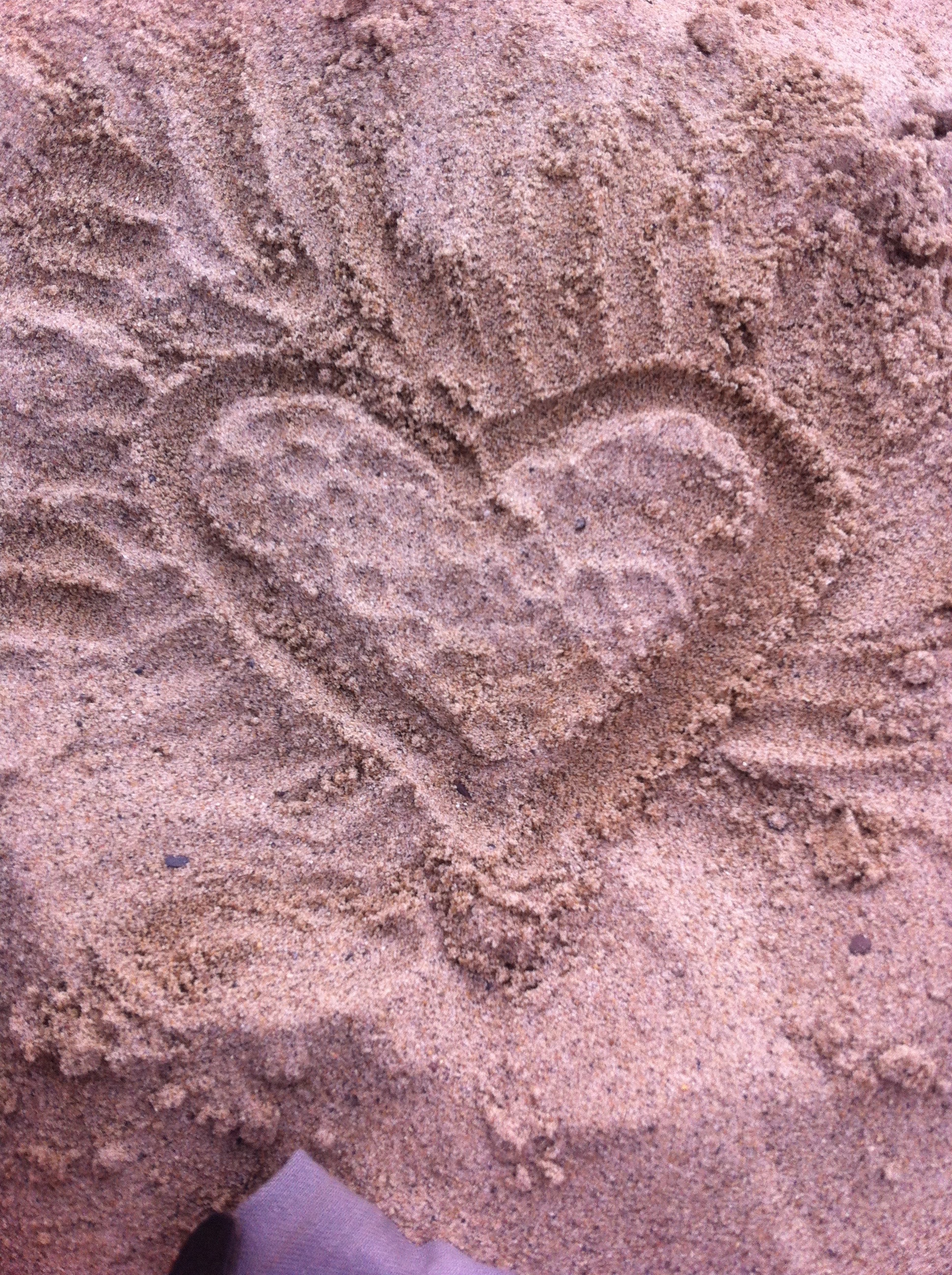 Drawing in the sand in Santa Monica, CA