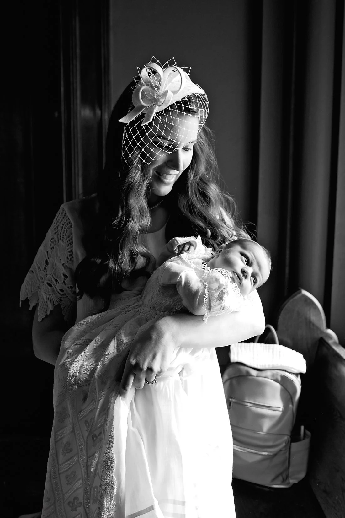 Mother with baby at Catholic Baptism St. Louis, Missouri