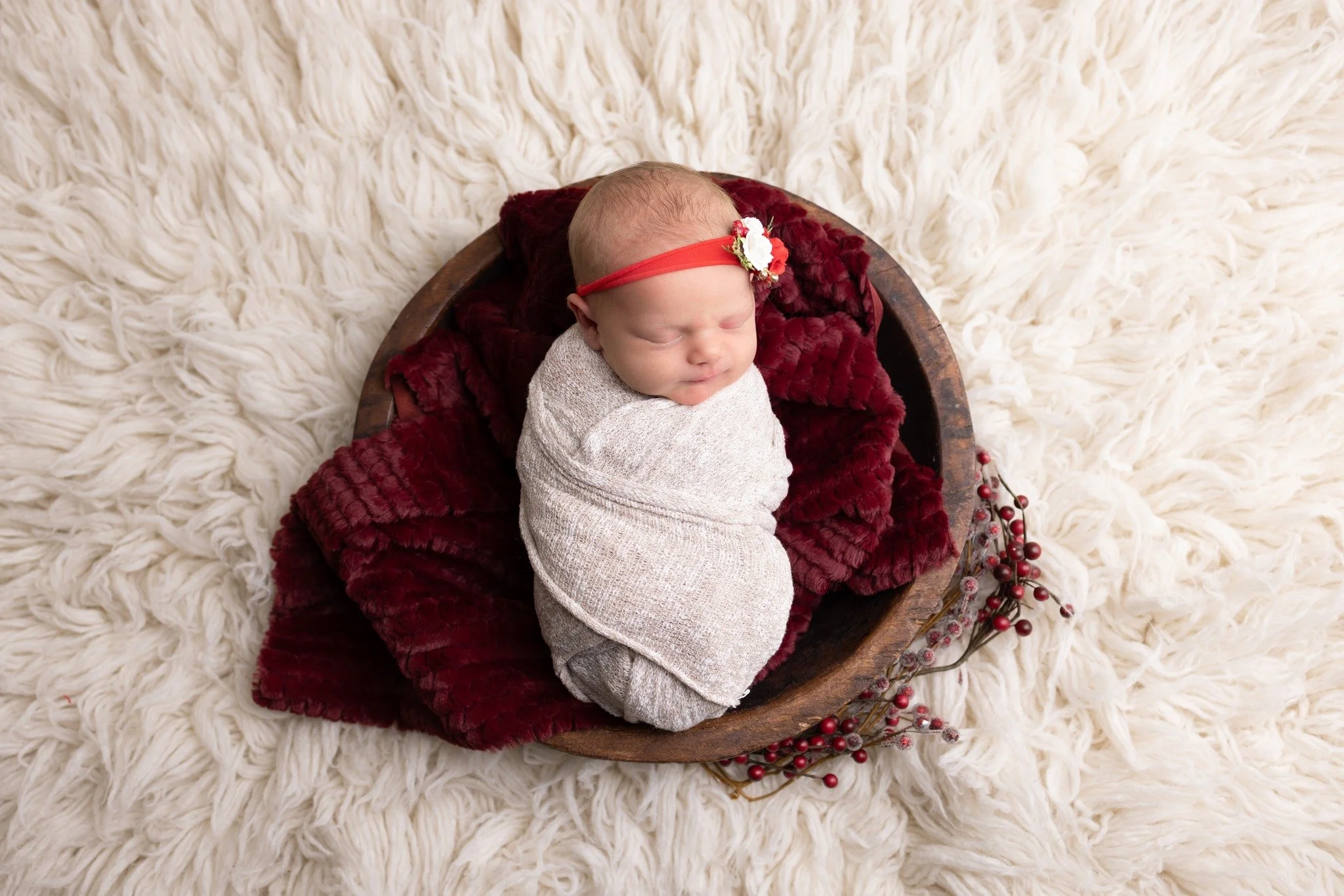 It's been a busy, busy day full of all the things that moms do before Christmas...and all the while we keep thinking of this precious newborn and her ability to just nap right through it all.

We've had several newborns in the studio in recent weeks,