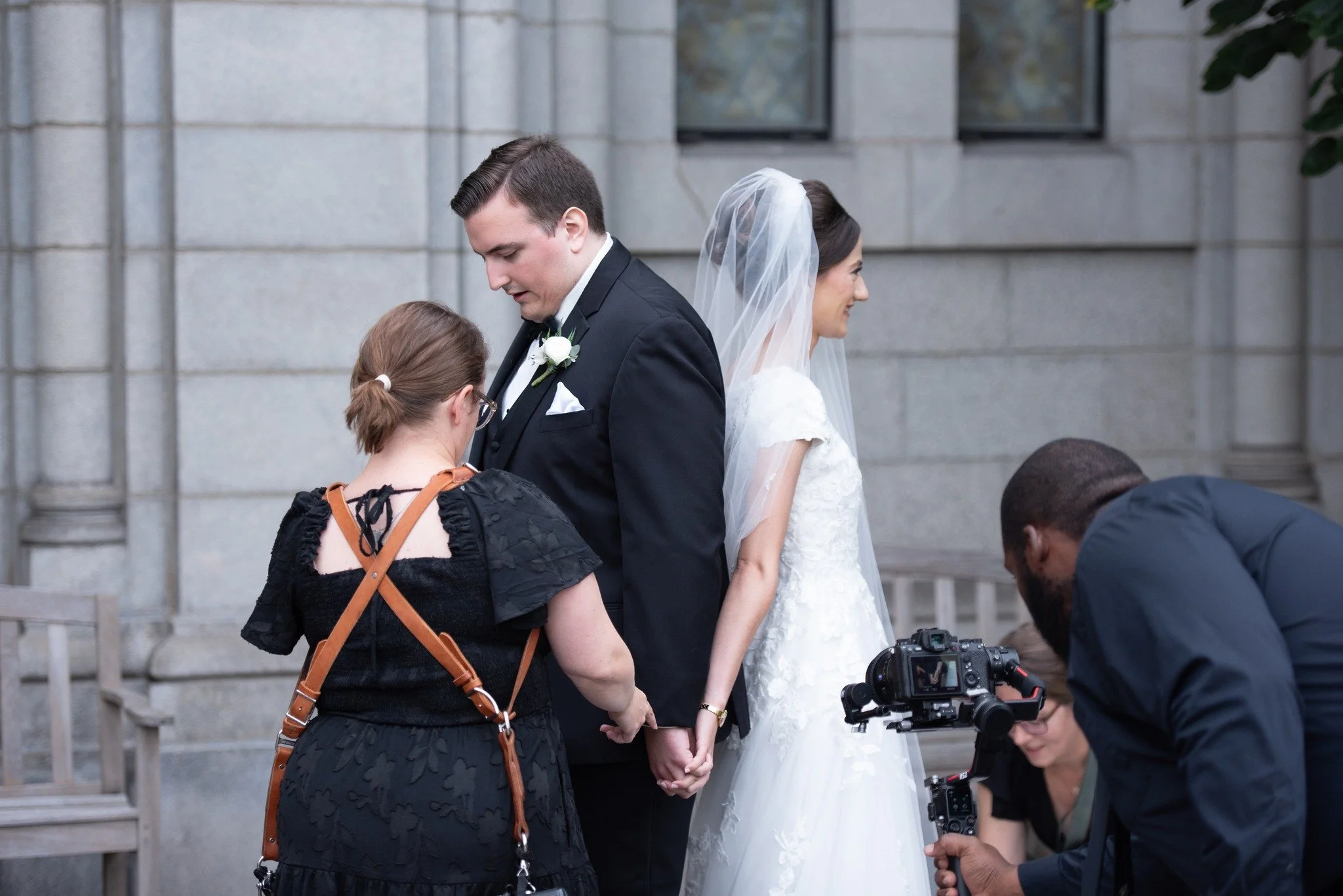 Behind the scenes moments like this are some of my favorites!

Posing the bride and groom while working hand-in-hand with the videographer is such a beautiful reminder that a wedding day is truly a collaboration. As we quietly guide, adjust, and step