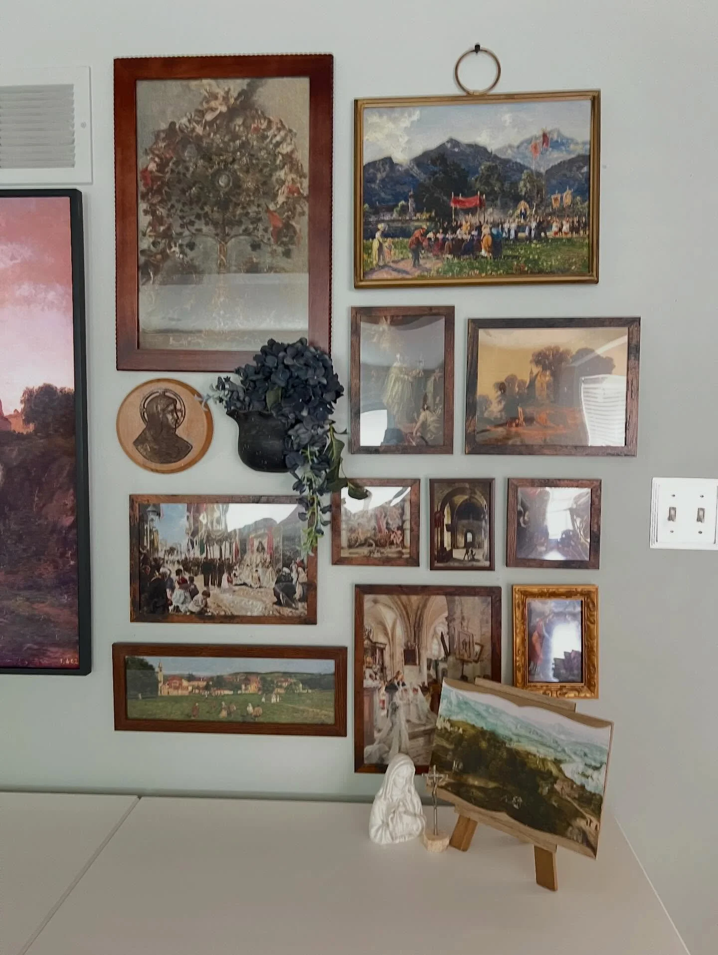 I wanted to stop a moment and share what I&rsquo;ve been working on! I love the gallery wall trend happening now. But I didn&rsquo;t like the artwork. So I sourced Catholic paintings and created a gallery wall in my living room. My kids were all surp