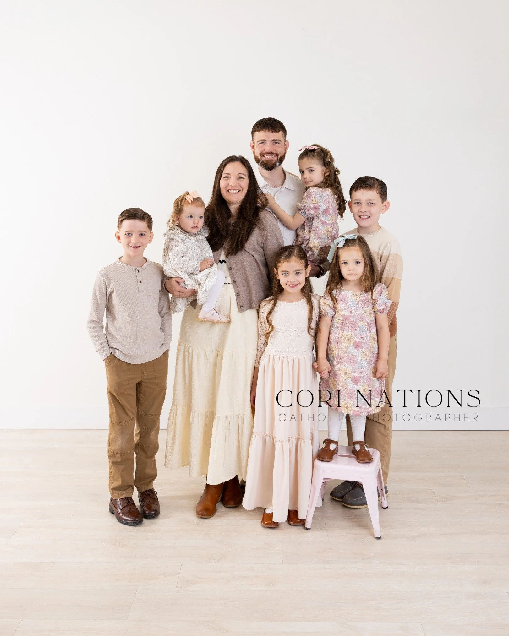 I love studio sessions like this because they allow the focus to stay where it belongs: on faith, family, and the gift of each child. The little hands, the quiet glances, the joyful smiles, and the love that fills the room&mdash;these are the moments