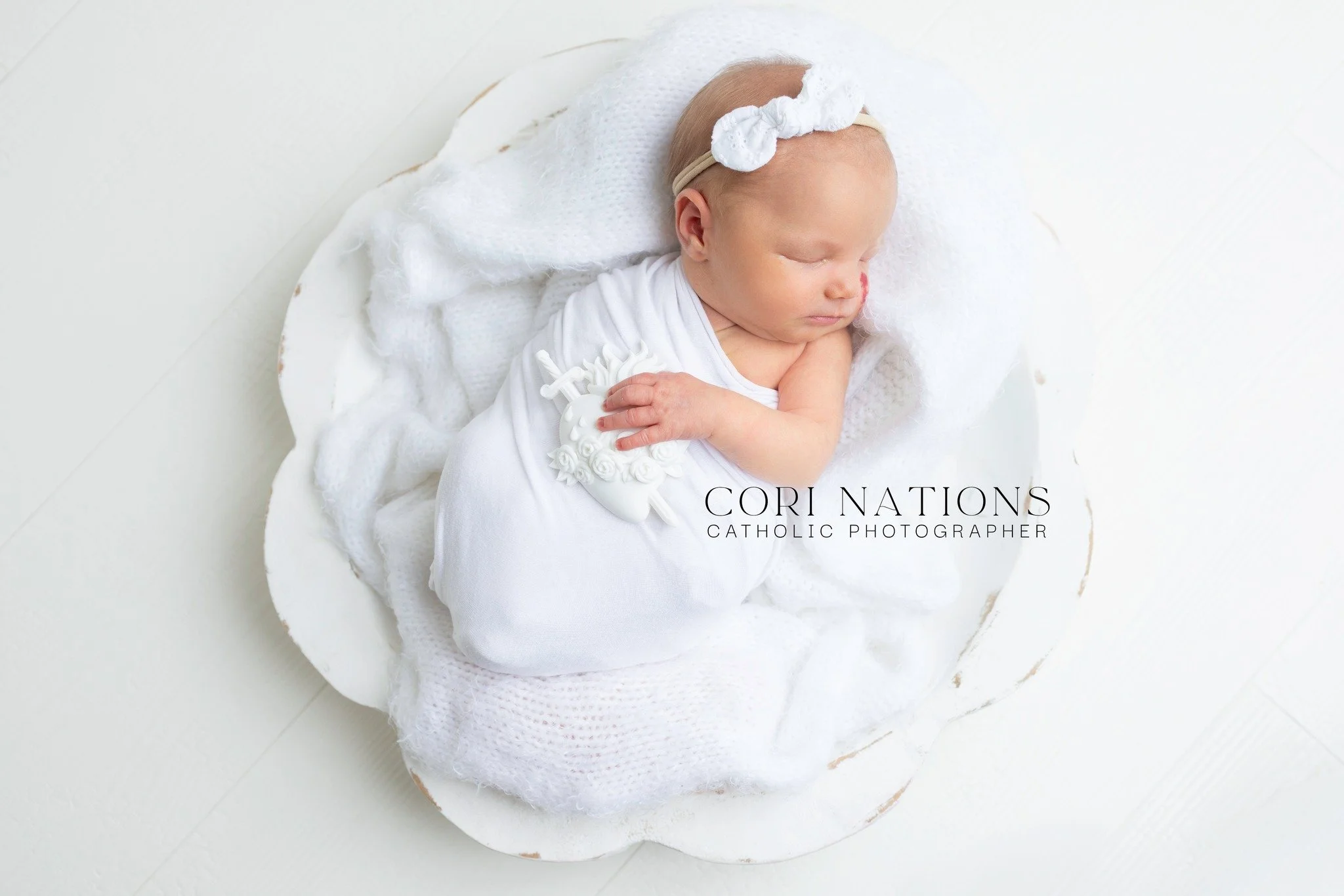 I just HAD to pop on here to share this sweet girl ... and a new prop I have in the studio. Swoooooooon. #corinationsphotography #catholicnewborn #stlouiscatholicphotographer #catholicnewbornphotographer #stlnewbornphotographer