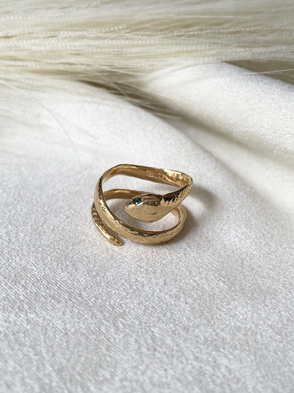 wrapped around coiled snake ring gold with green gemstone eyes