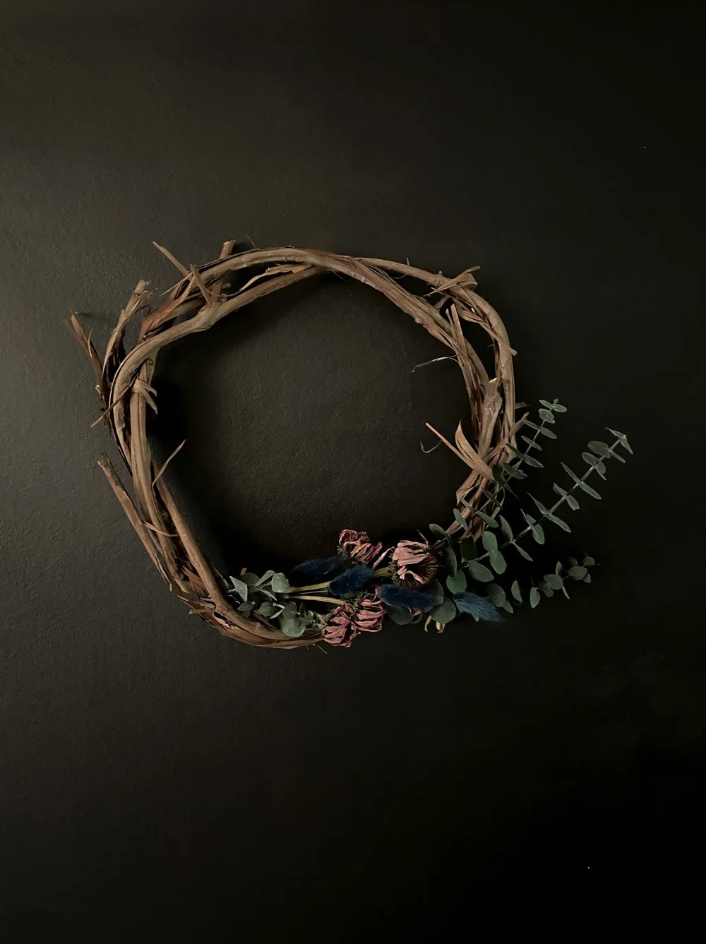 Handcrafted wreath made of foraged grapevine and home grown dried flowers.