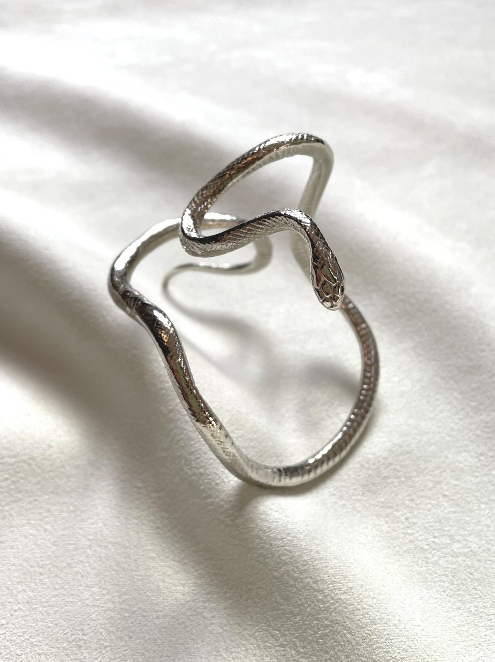 white-bronze-snake-arm-bracelet.jpg