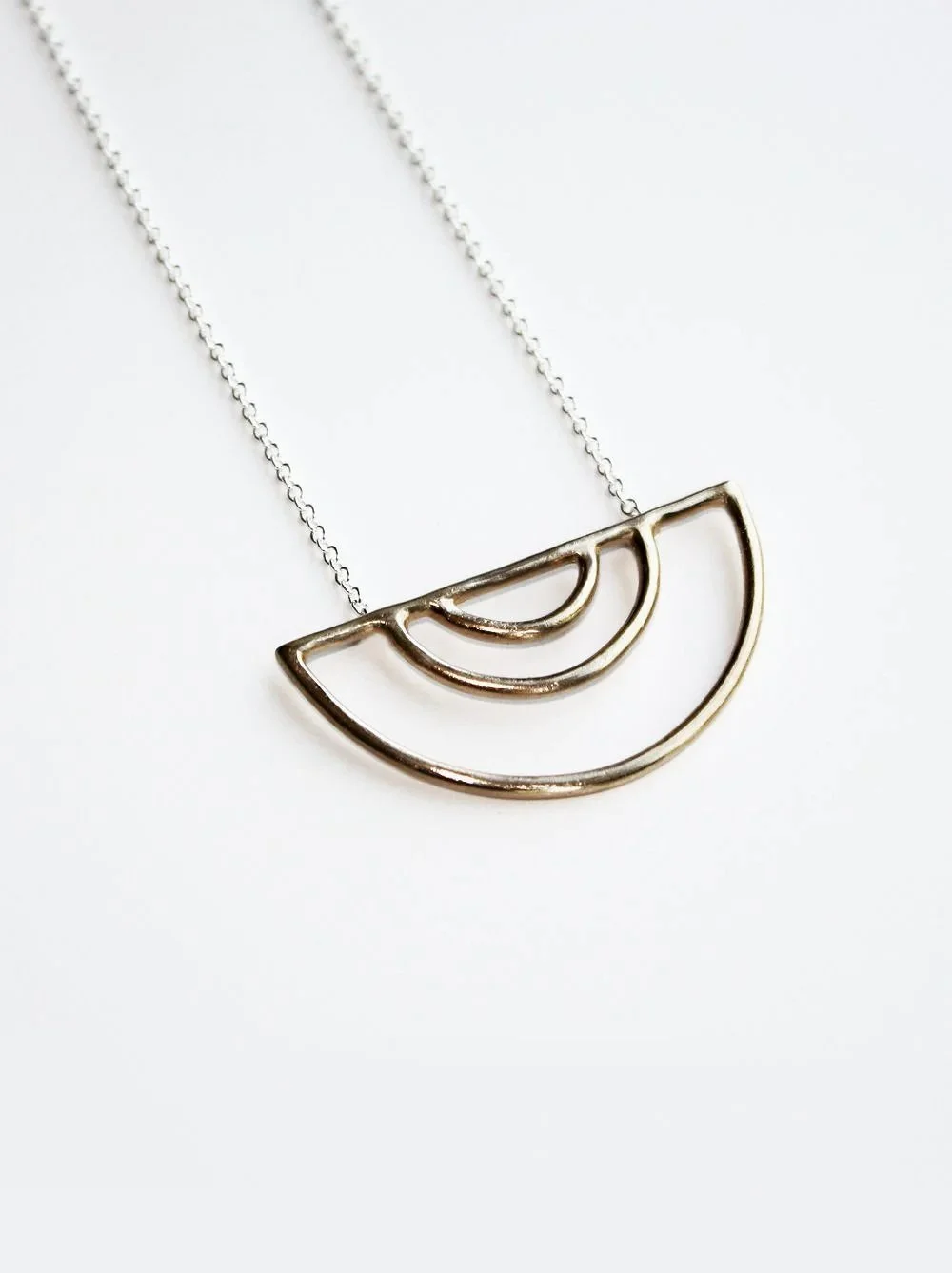 mixed-metal-arc-pendant-necklace.jpg