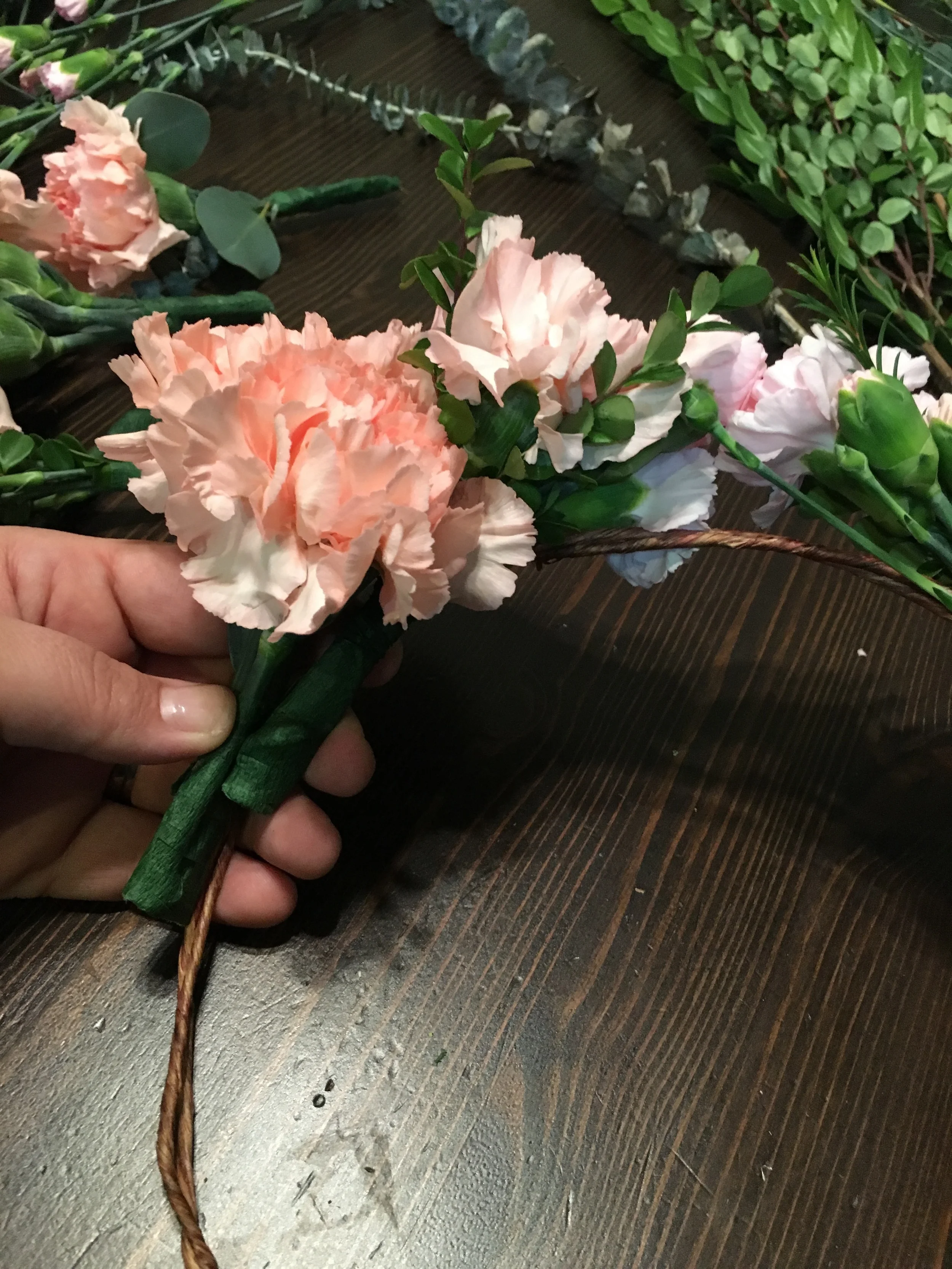 add the next layer on top of your previous bunch, and attach with wire.