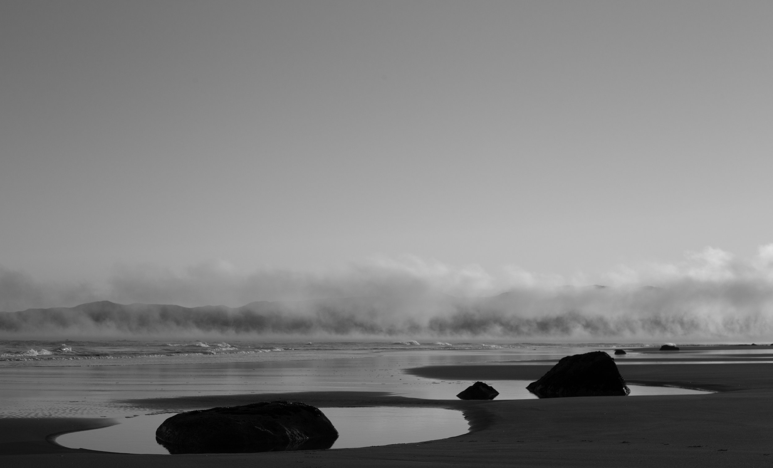 Sunrise Beach Fog Stones BW.jpg