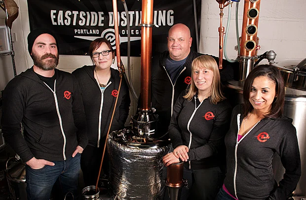 Photo: www.eastsidedistilling.com Melissa Heim is second from the right. She's a master distiller for Portland's Eastside Distilling, the first woman master distiller west of the Mississippi and the youngest master distiller in the United States. 