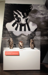 The image of Translator floats above Tahu, leader of the blind archers, and the conquistador who blinded her. Installation view of Revolt 1680/2180: Virgil Ortiz , © Virgil Ortiz.