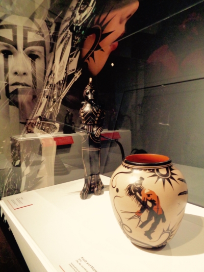 The reflections of Cuda, the aeronaut; Tahu, the blind archer; and Mopez, the cardinal headed messenger, watch over the figures of two Venutian soldiers. Installation view of Revolt 1680/2180: Virgil Ortiz , © Virgil Ortiz. P hoto: CS Peterson © 2016. 