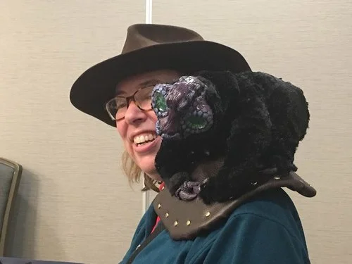 CS Peterson and her jeweled black quaver at MileHiCon 48. Photo by Sam Knight.