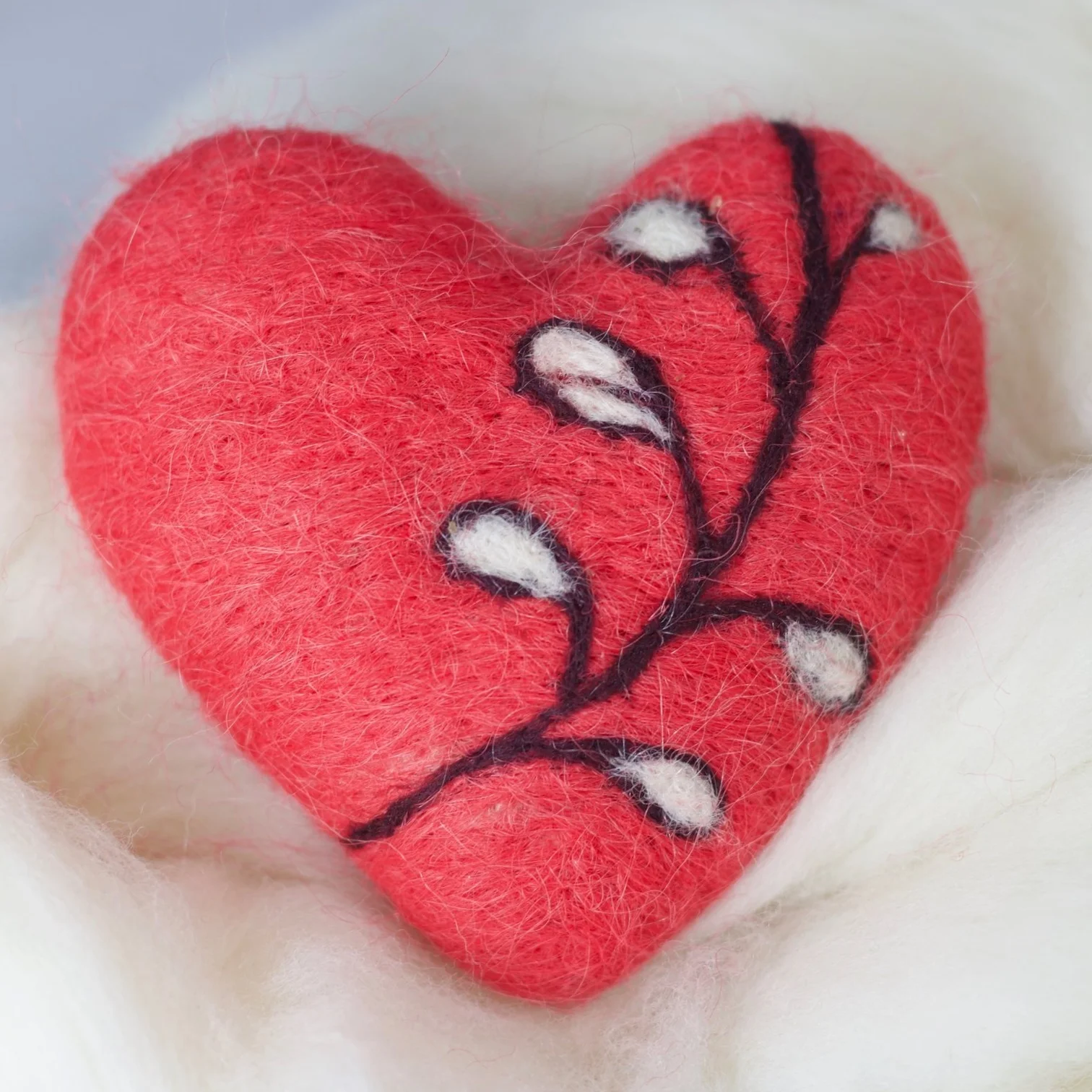 Let me teach you to poke wool into a heart-shaped thing!