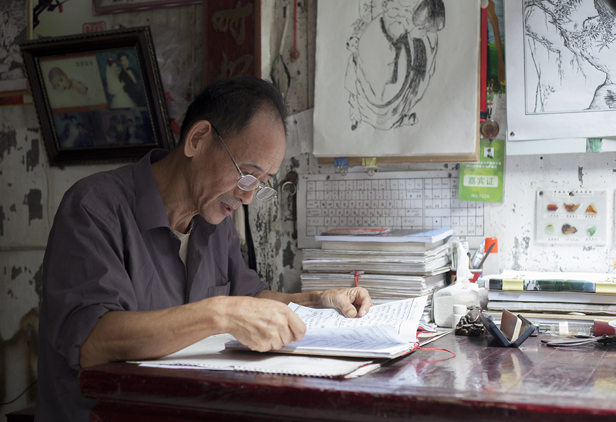   Wang Shouchang, 67, is a 93rd-generation member of the Wang family that once dominated village life in Bishan. Wang devotes much of his private time to researching the kinship history of the region. In the past, people relied on ancestral halls and