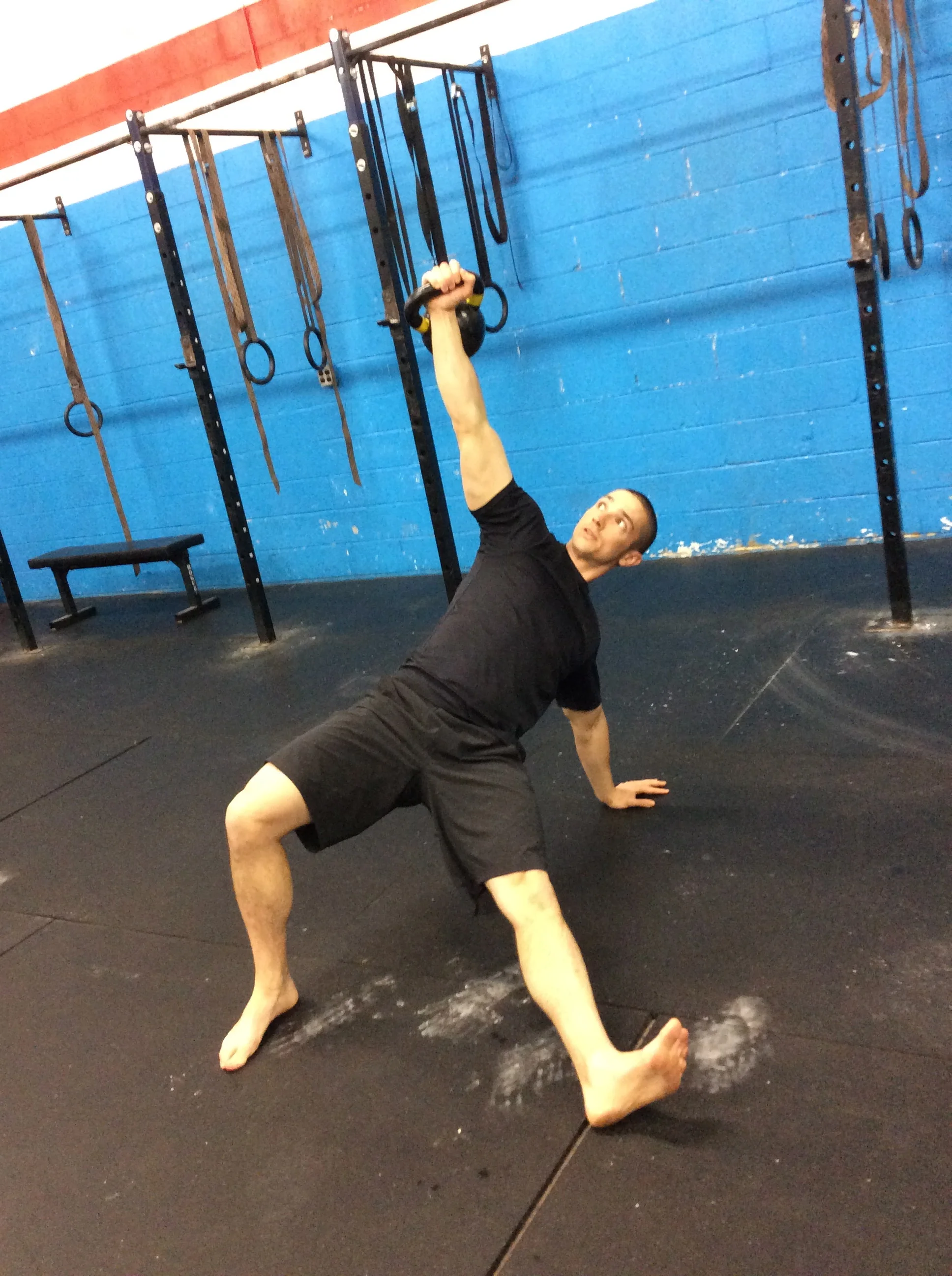 The Turkish Get-Up is perhaps the best example of true movement training. At its core, the get-up is simply training the common human skill of getting up and down from the ground efficiently. Yet it’s also a highly complex movement that must be progressed slowly and methodically for true mastery. Clearly, the get-up is not is an attempt to isolate specific muscles, but rather an effort to integrate the entire body to work as one functional unit.
