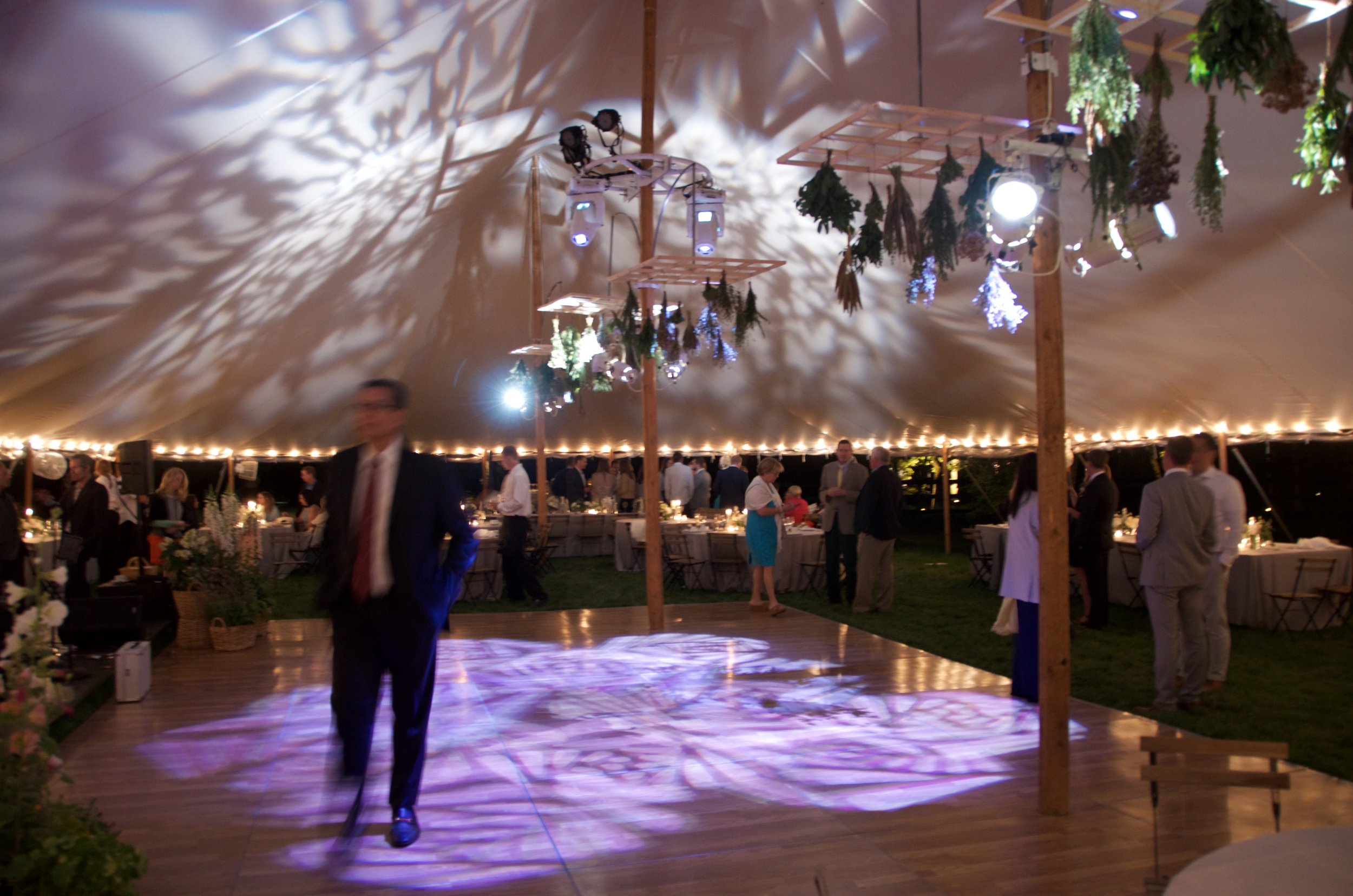 Patterned gobos and dance floor lighting for a tented wedding