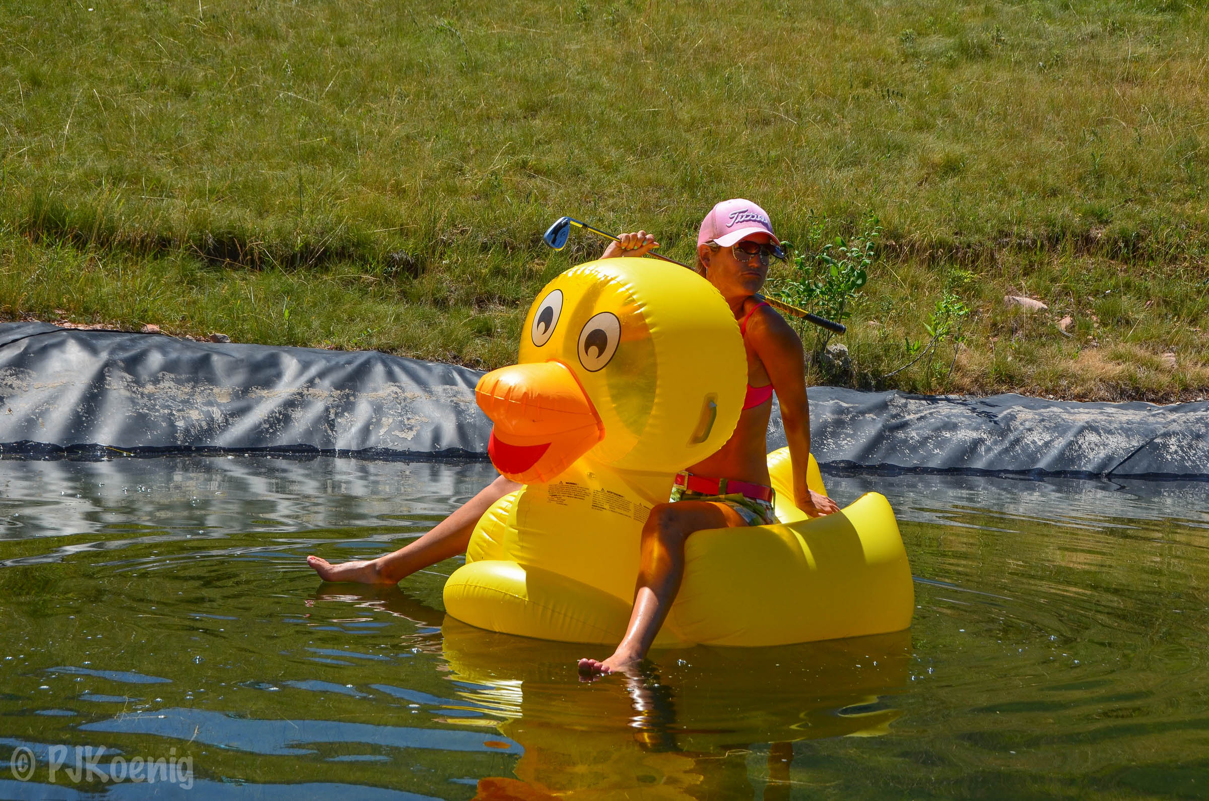 On call doctor, Sarah Moodie, plays a tough lie from the water hazard on #15