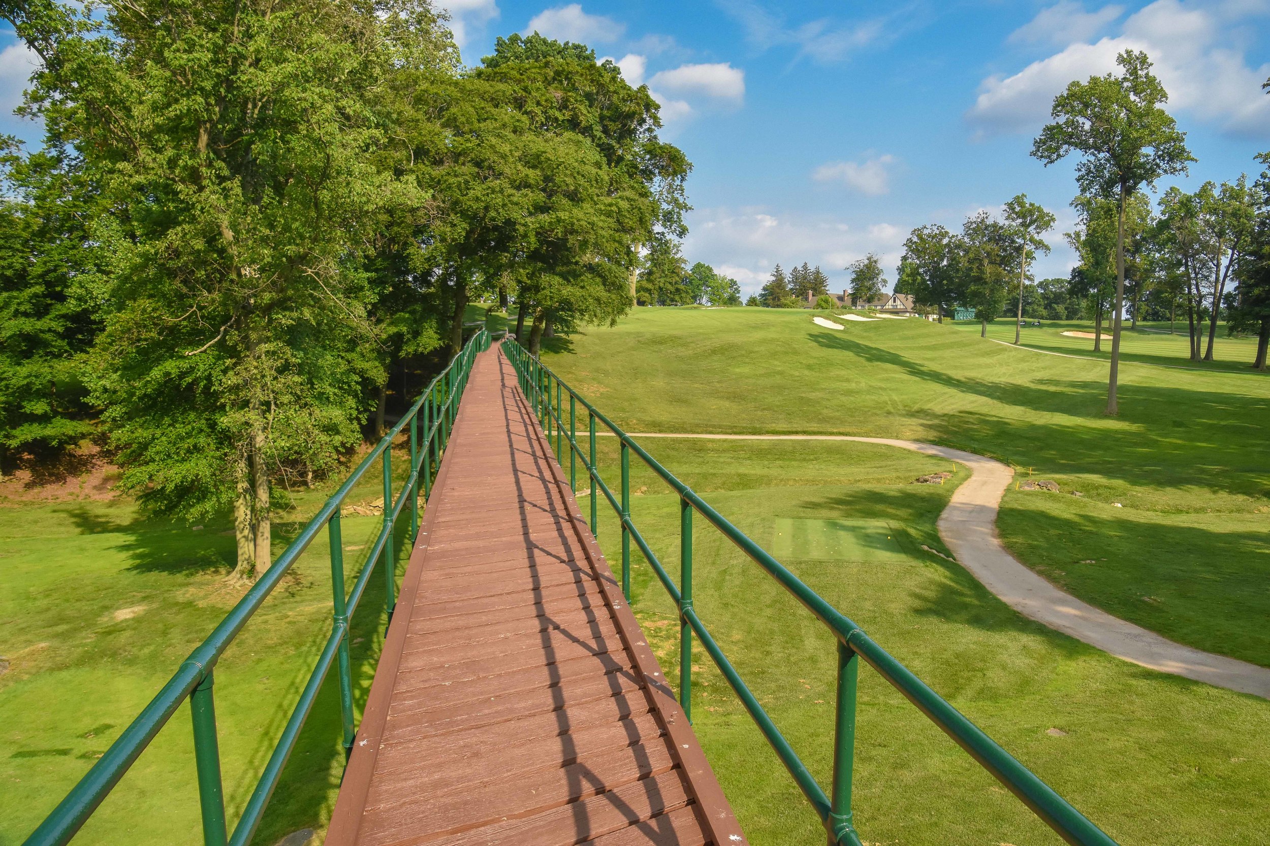 The unique walking bridge on the long par 3 14th hole at Rolling Green.