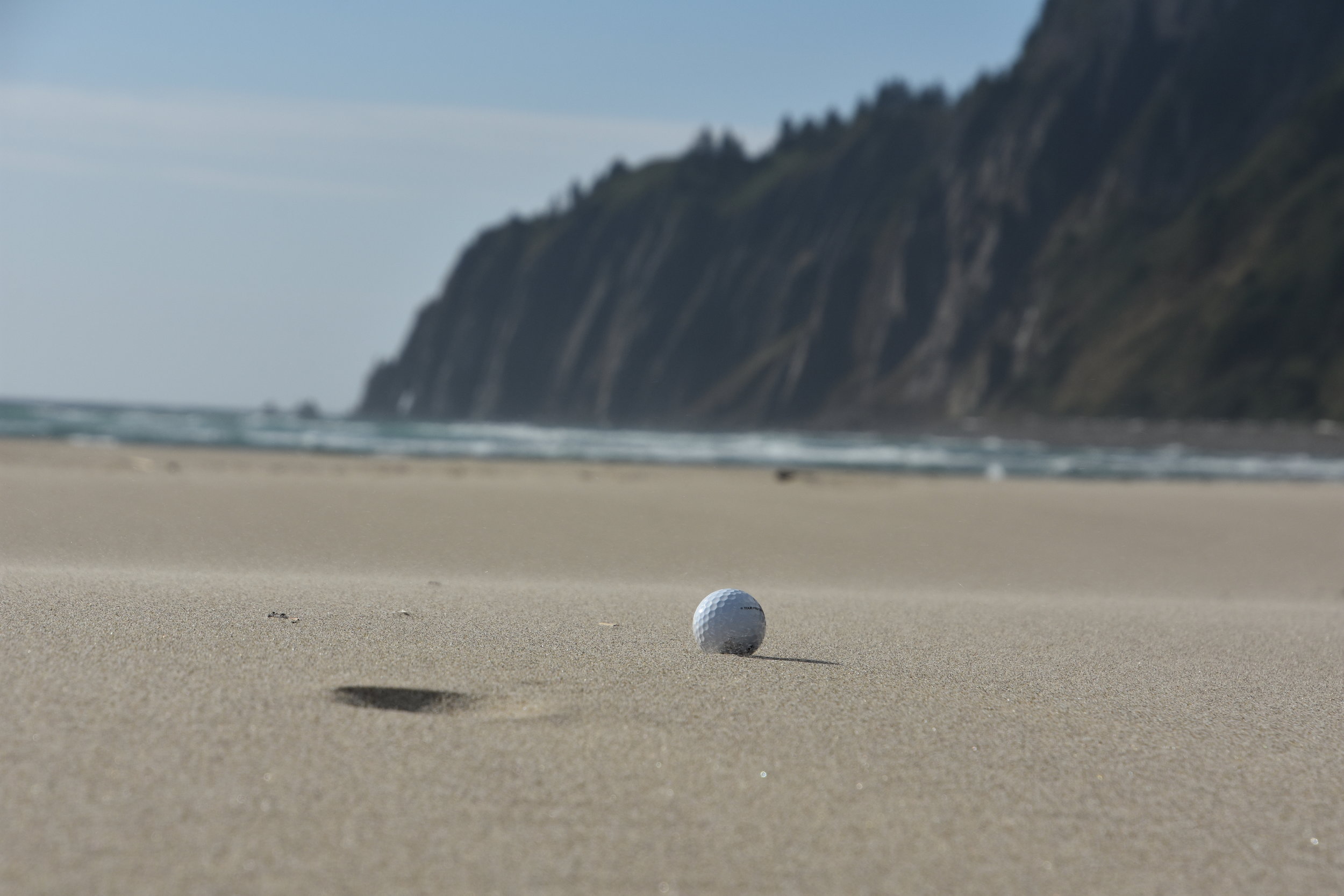 The ball just lies there, waiting, beckoning to be struck. It rests gently in the sand, tempting you. Come and play!!