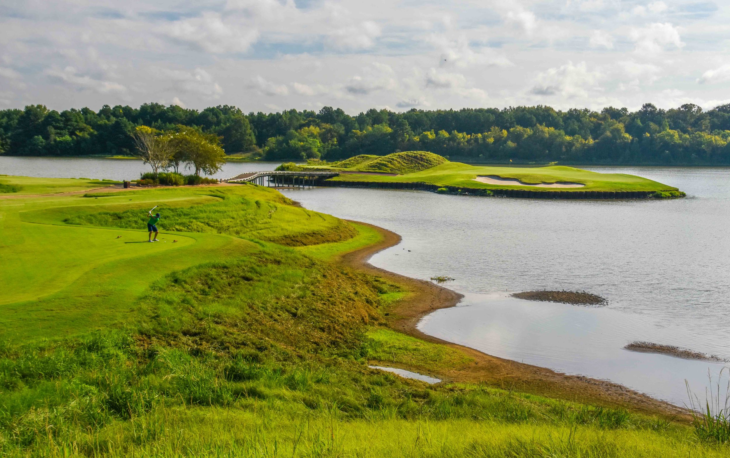 Trip Organizer, Nik Divakaruni, finds the green on the island 6th hole on The Judge at Capitol Hill .