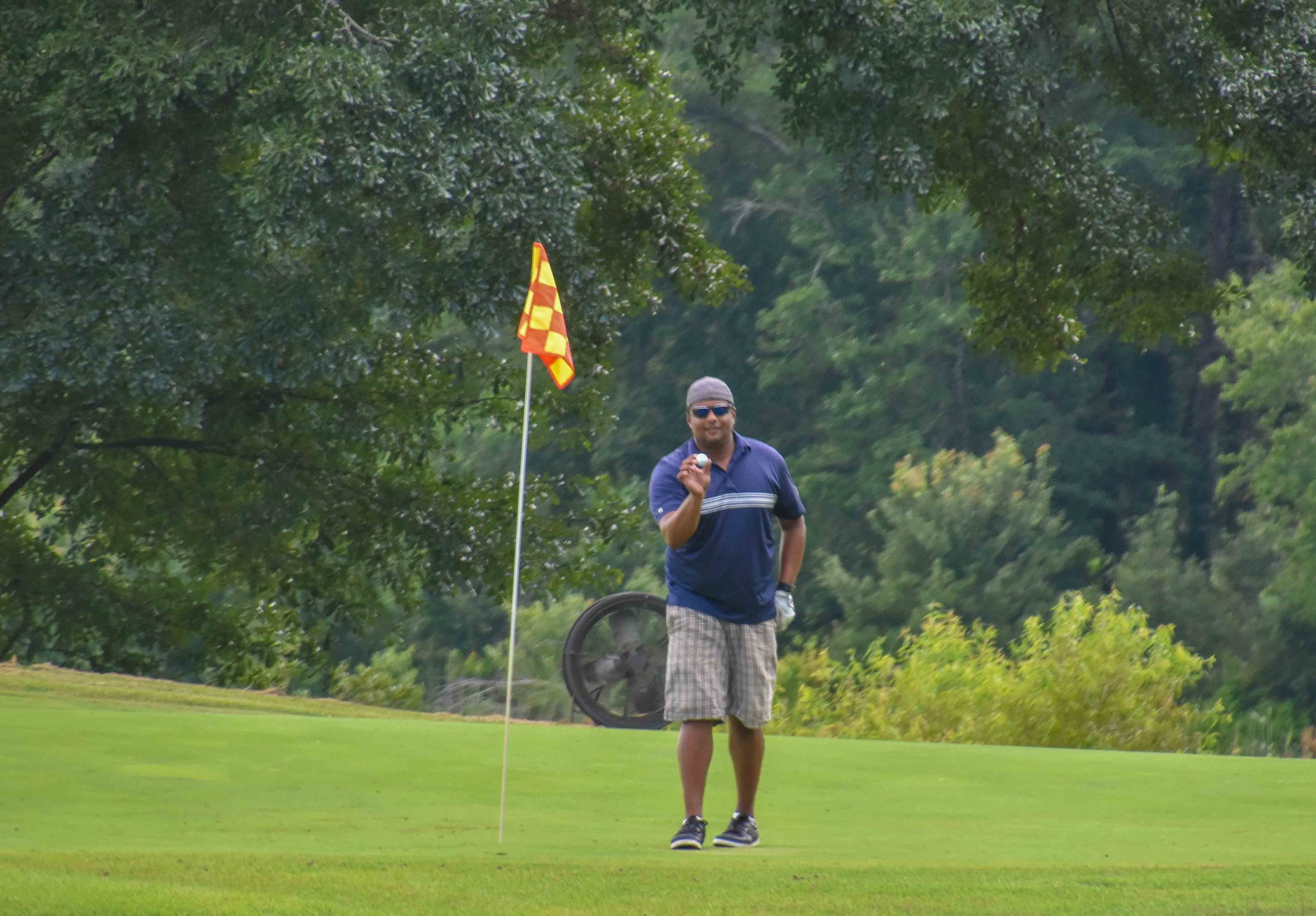 Golf animal, Nik, holes out from 150 yards and shows me the ball. What a boss!