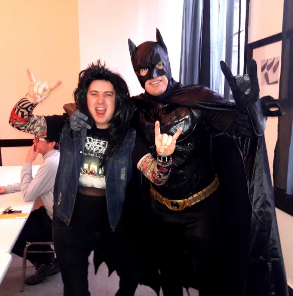 Costumes are encouraged at "The Saw." Here we see evidence that Batman and the Head Banger are indeed friends with Satan.