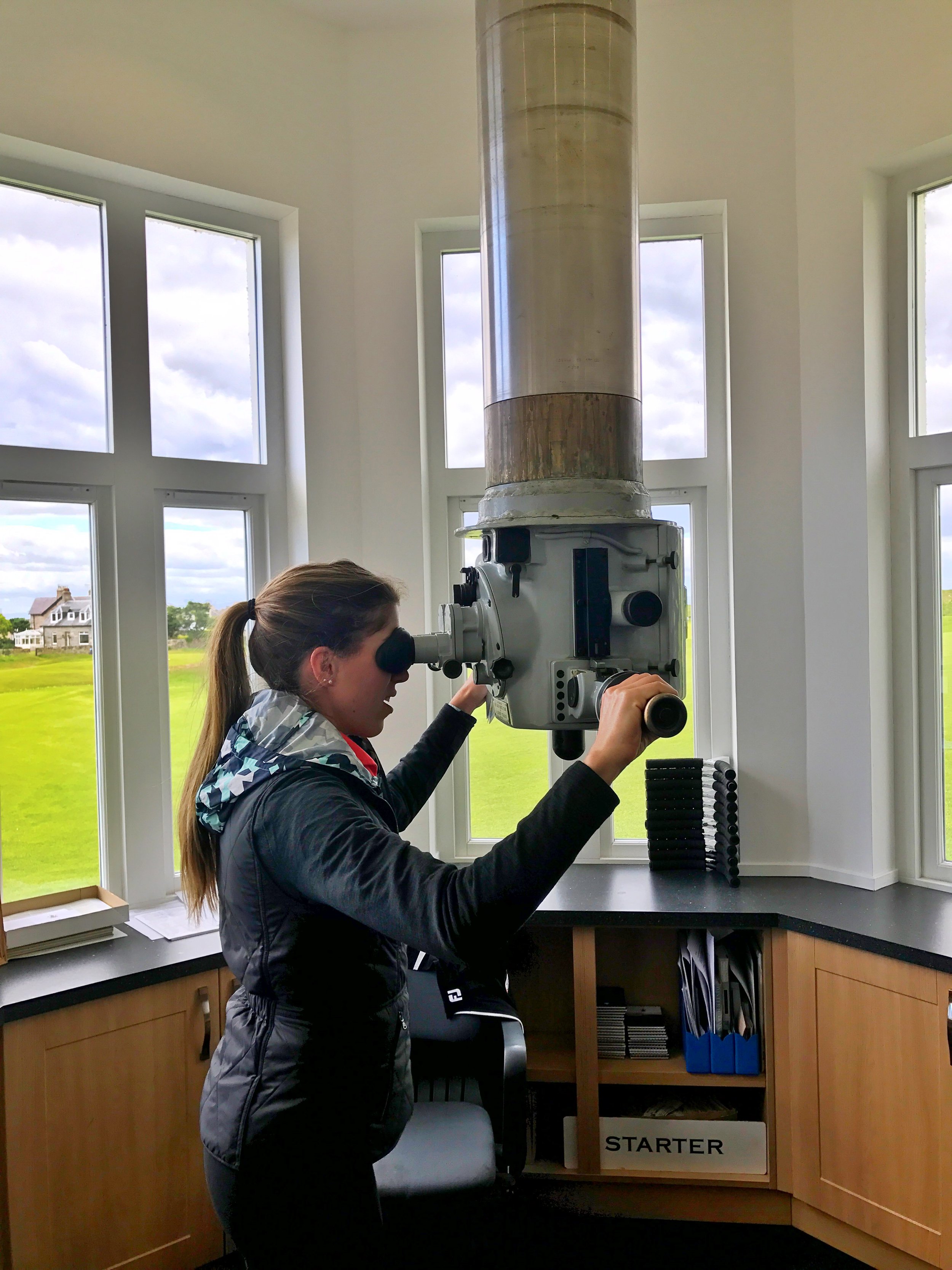 Ashley checks out the periscope clubhouse at Elie Golf Links. This is an actual periscope from the HMS Excalibur submarine that allows the starter's office to alert golfers when the 1st fairway is clear.