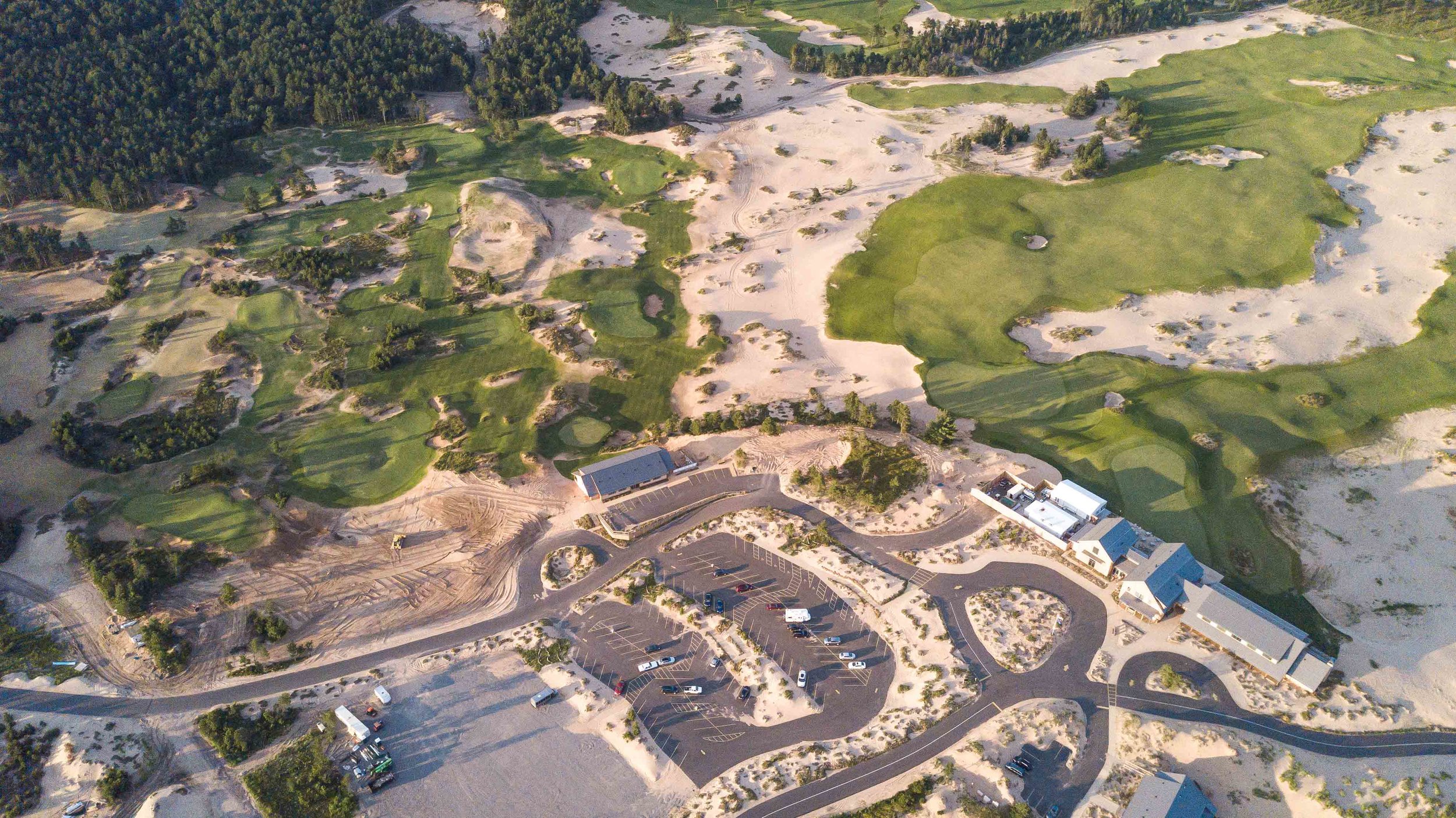 Even the parking lot at Sand Valley is filled with sand. You can see the resort's par 3 course in the top left and the 1st tee and 18th green on Mammoth Dunes on the right.