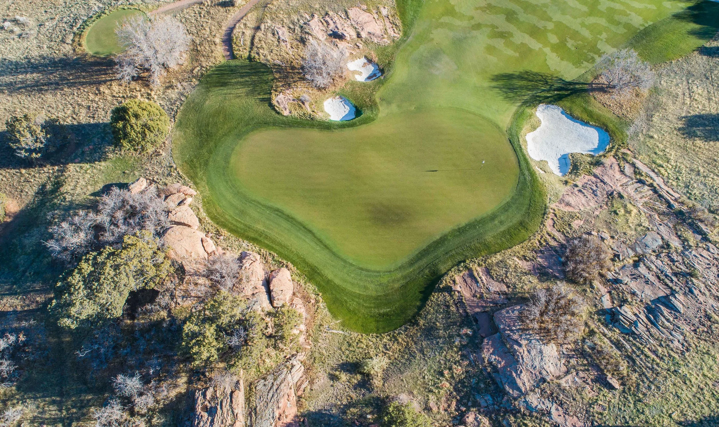 The 8th hole at Red Ledges finishes right into the rocks.