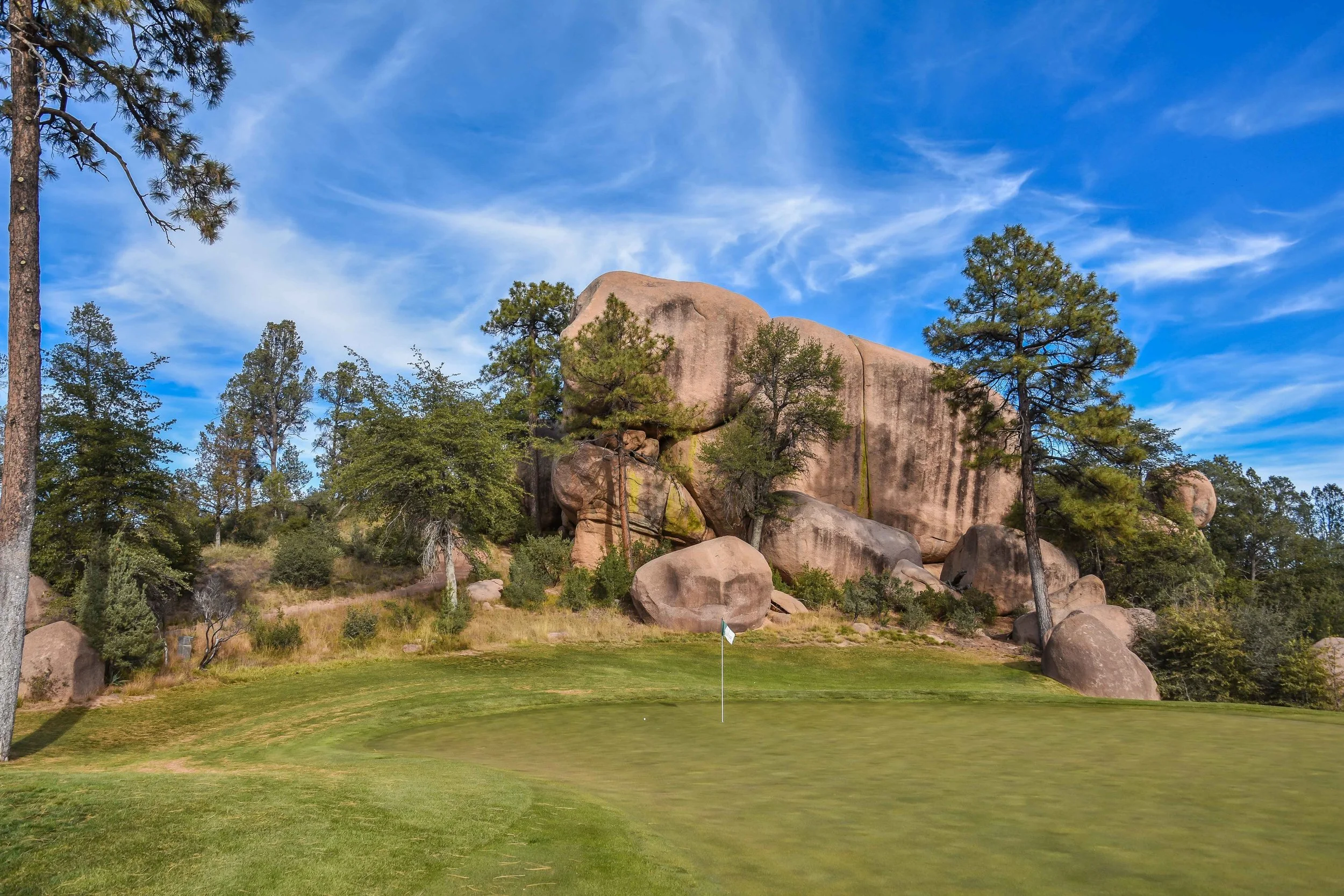 The 13th green is framed by some serious rocks.