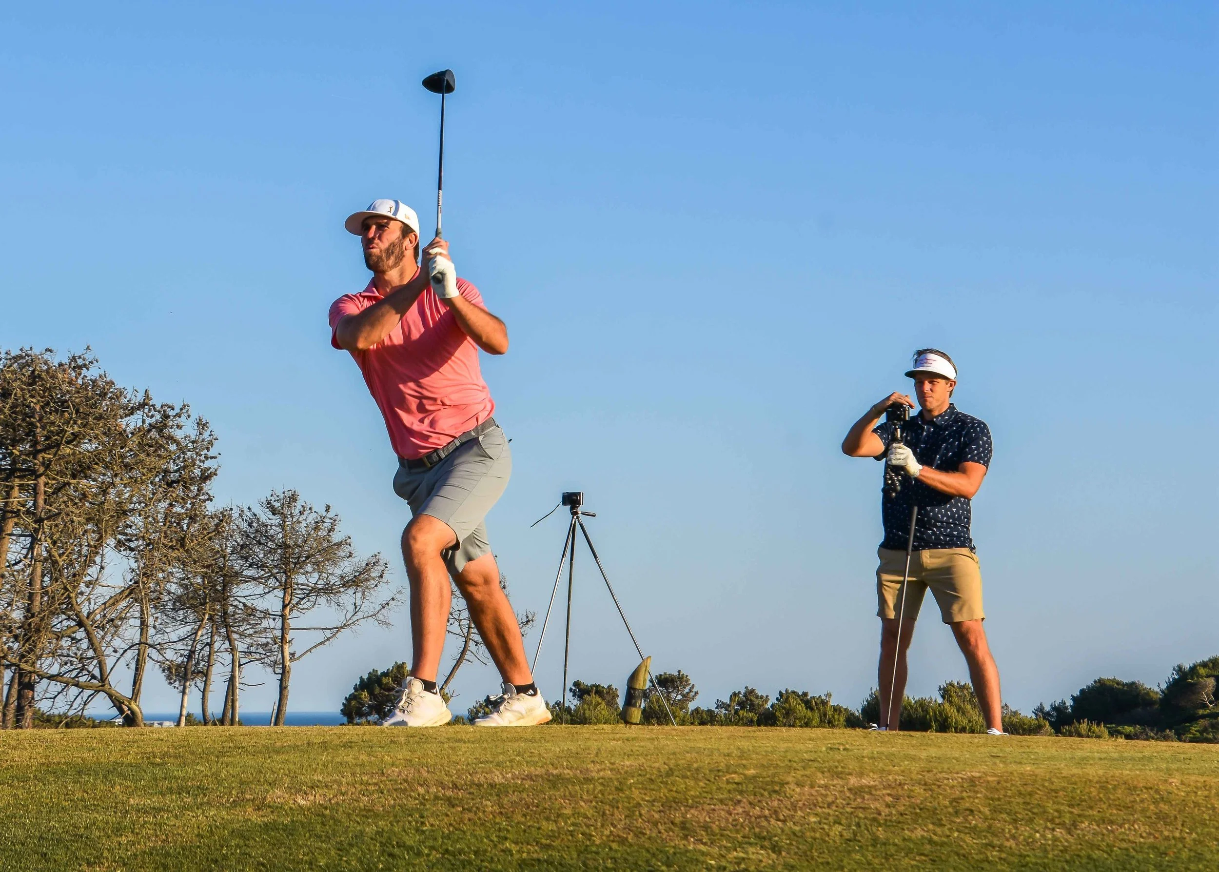 Brodie rips a driver. The shot tracer is on the left and Blair Wheeler is on the commentary.