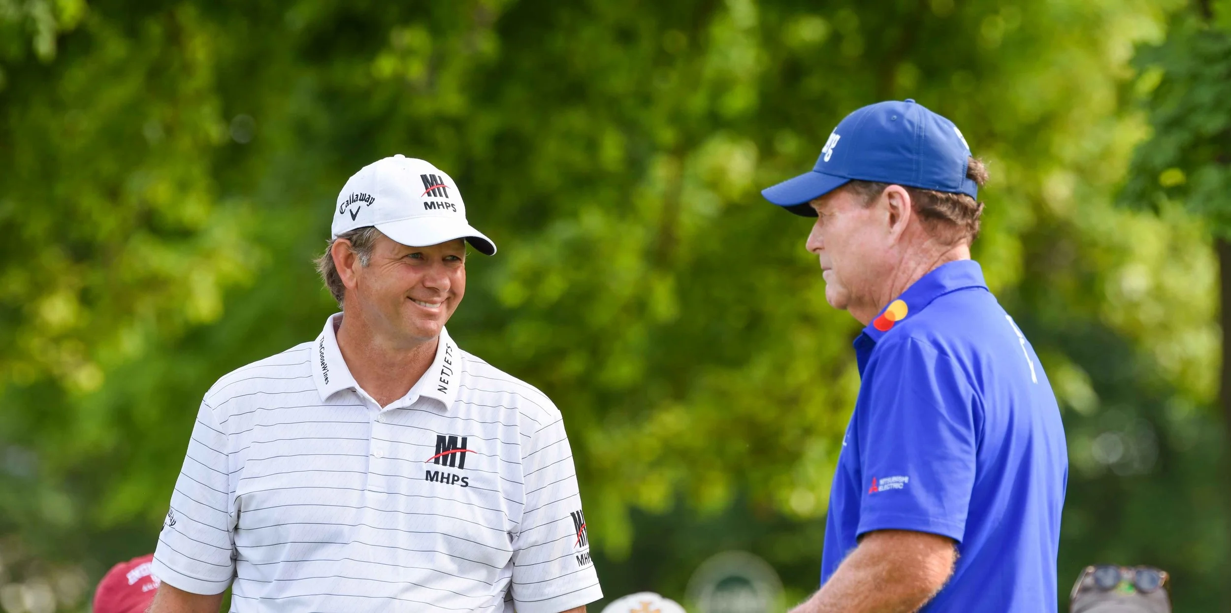 Retief Goosen and Tom Watson chat it up.