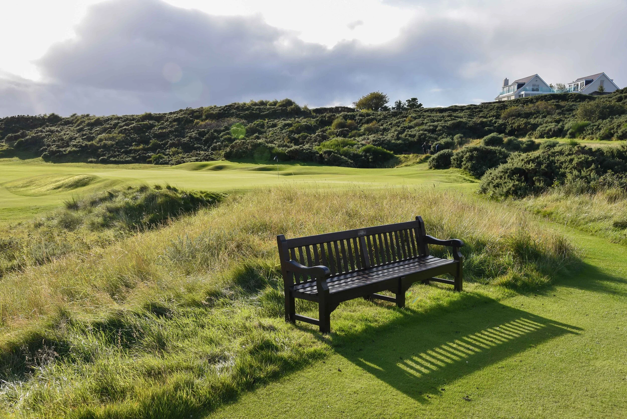 The bench behind #11 looking back onto #4 green.