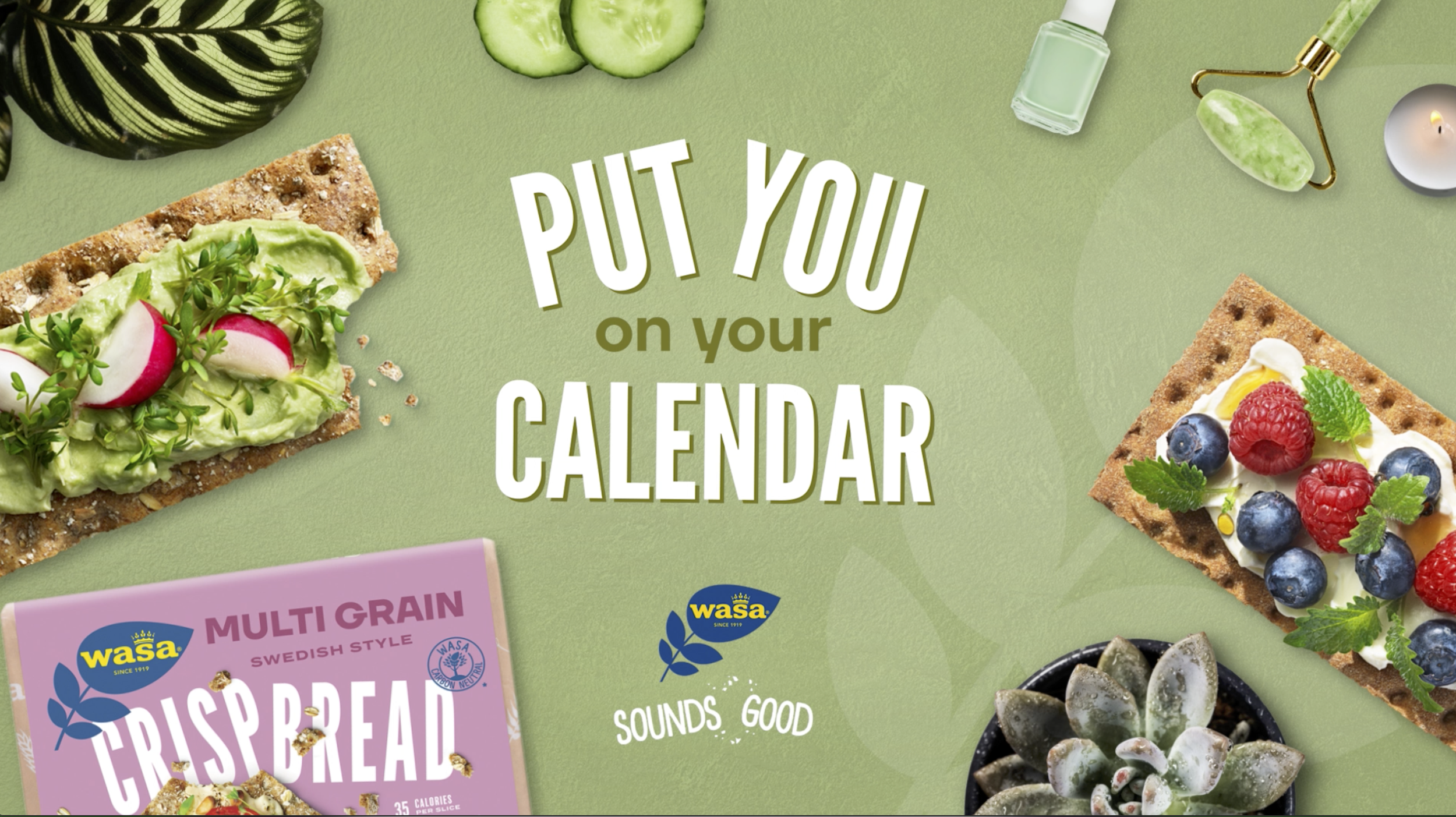 Green background with various snacks including avocado toast with radishes and microgreens, fruit-topped crispbread, a box of crispbread, a jade roller, a nail polish bottle, a candle, and a succulent plant. Text reads, "Put you on your calendar" and