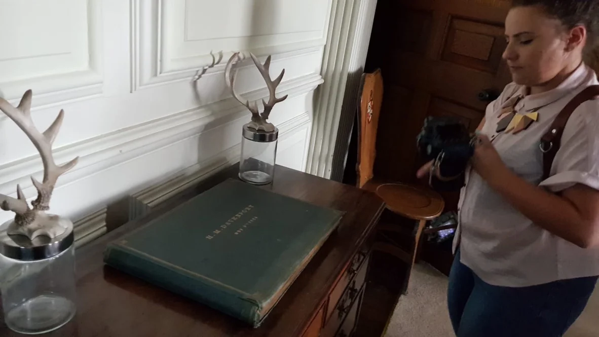 Steph takes a moment to peruse the beautiful collection of illustrations we discovered in this original portfolio of H.M.Davenport. 