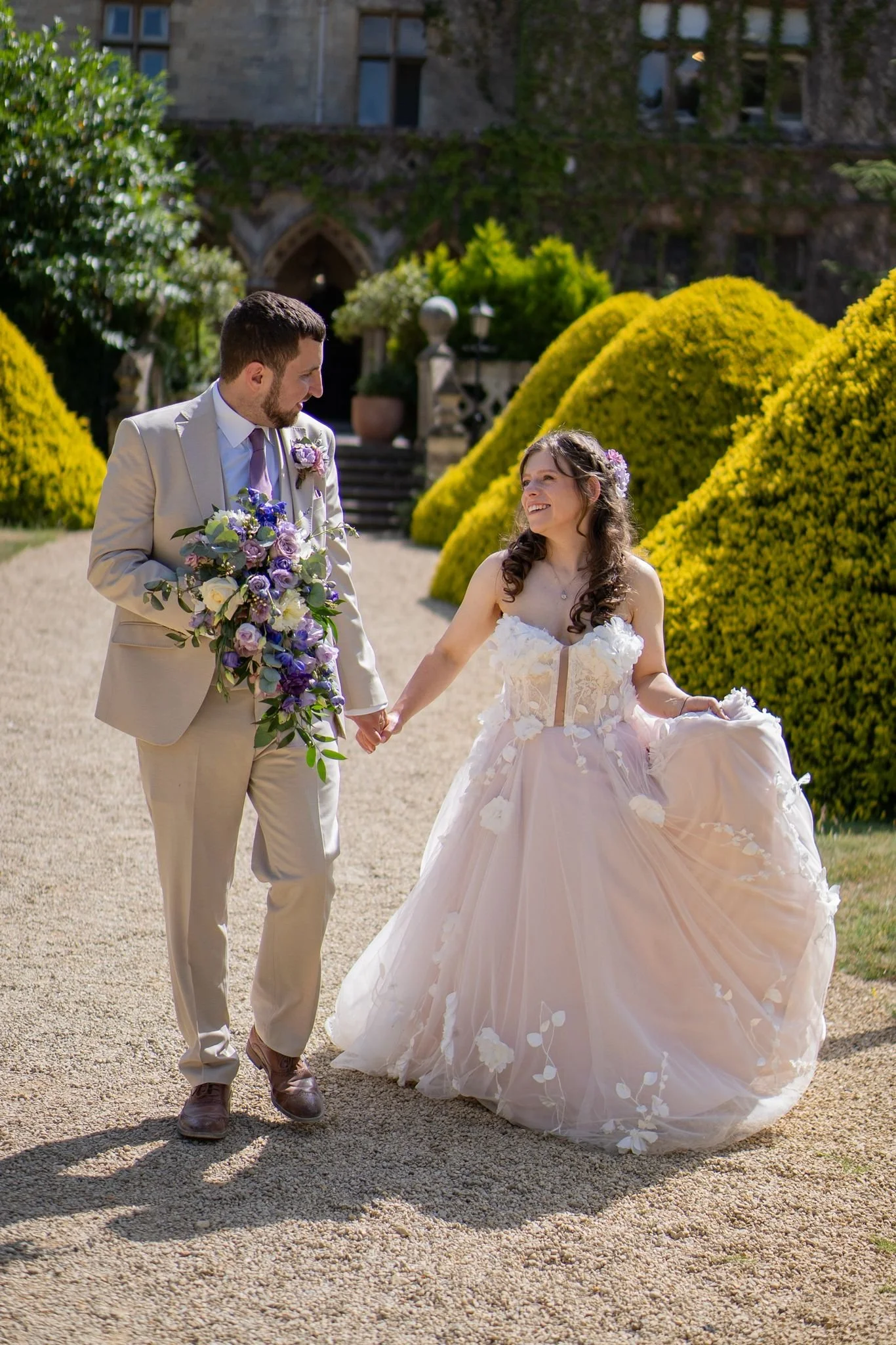 Real bride Christine in her bespoke bridal gown made by My little Wedding Shop bridal designer - Jennifer Bone. Soft pink with ivory tulle and 3D floral ivory lace - semi-sheer bodice and trailing lace flowers.