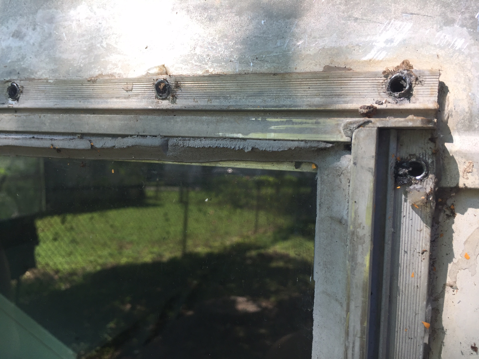 You can see some of the silicone caulking hanging around the edges.