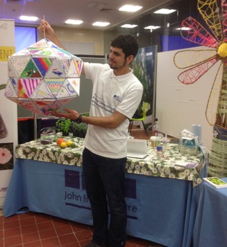 Roger Castells-Graells showing off the 80-sided virus structure built with the creative help of lots of kids at Norwich Science Festival.