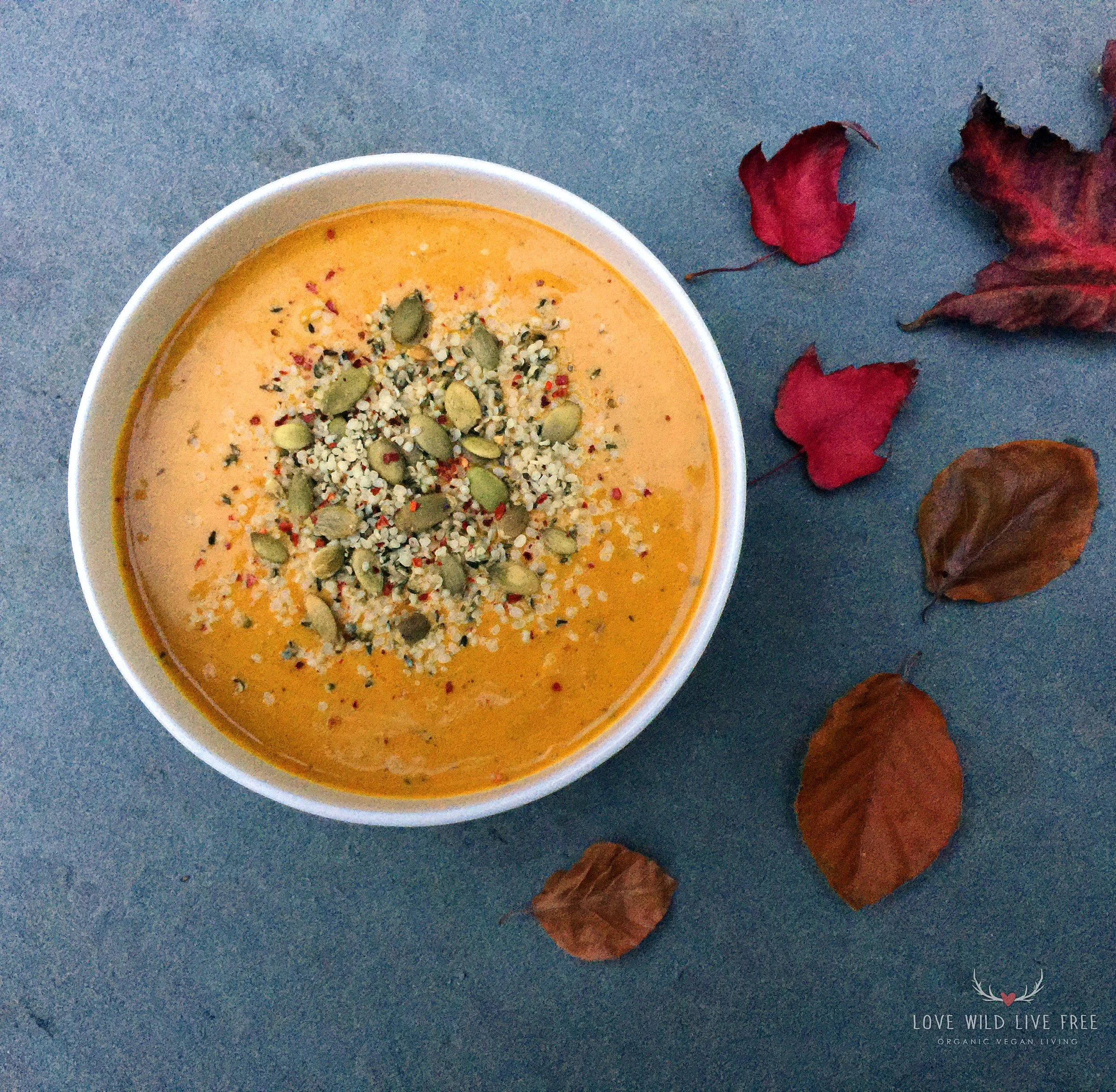Creamy vegan coconut curry butternut squash soup, topped with raw pumpkin seeds, hemp hearts and red pepper flakes! Immune boosting spices and clean, dairy-free ingredients, for a warming meal as the cool weather rolls in.