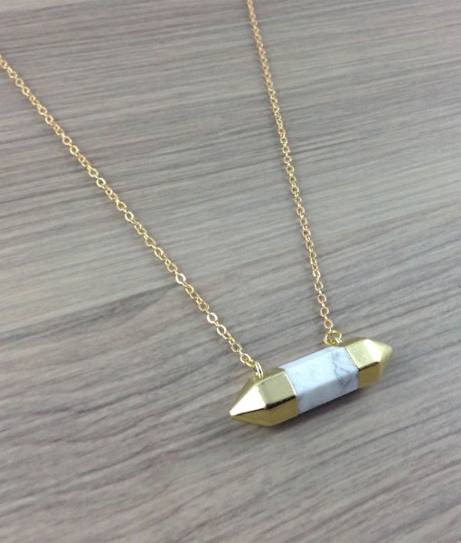 White Howlite pointed necklace from Subject II Change. 14KG plated chain, Gold plated stones, Gold Plated lobster clasp and Gold Plated findings. Howlite Is a super-calming stone and many people use it to relieve stress of all kinds. It makes an excellent antidote to insomnia due to an overactive mind. Focusing on a piece of howlite can assist in journeying outside the body and gaining insight from past lives. Placed on the third eye, it opens memories of previous times and lifetimes. Photo source: Subject II Change. 