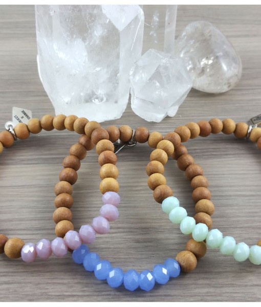 Crystal Power Bracelets from Subject II Change. Materials: Sandalwood Beads from Bali, Czech Crystal beads, and clear elastic cording. Sandalwood: Is a both soothing and fragrant. It attracts positive energy, and clear perception and promotes tranquility. Wearing Sandalwood acts as an antidepressant, antiseptic, and is a sedative wood. It promotes healing of the cells and assist the immune system with preventing illness. Photo source: Subject II Change. 