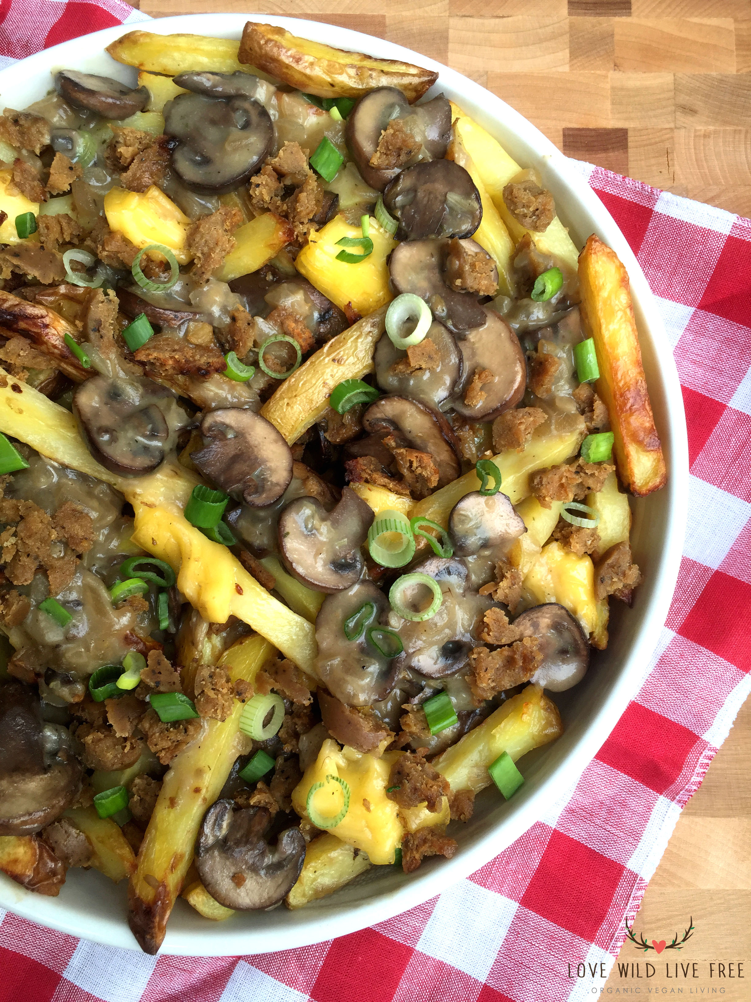 Epic Vegan Poutine with Field Roast Apple Sage Sausage, Creamy Chao Cheese + Mushroom Gravy. Photo by Love Wild Live Free.
